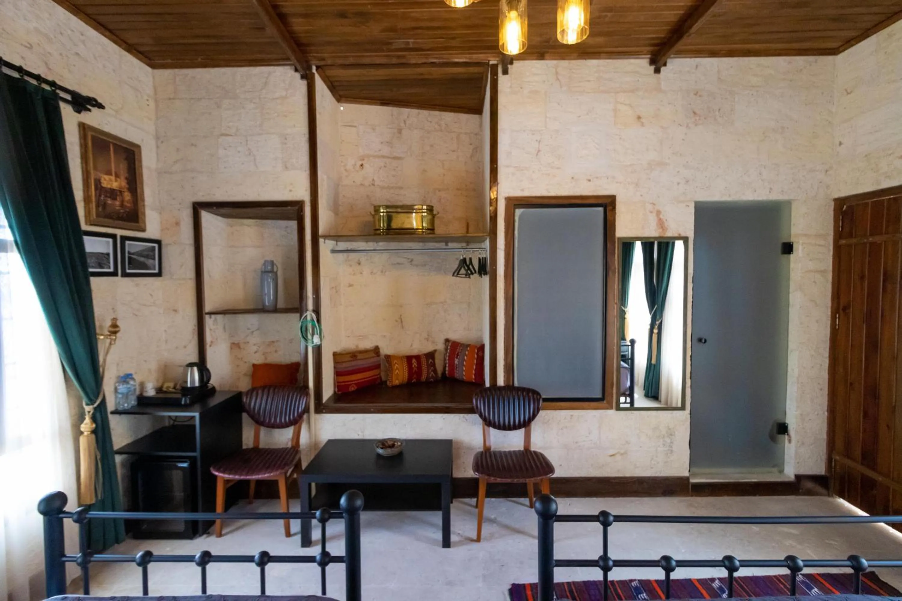 Seating area, Bed in Nomad inn