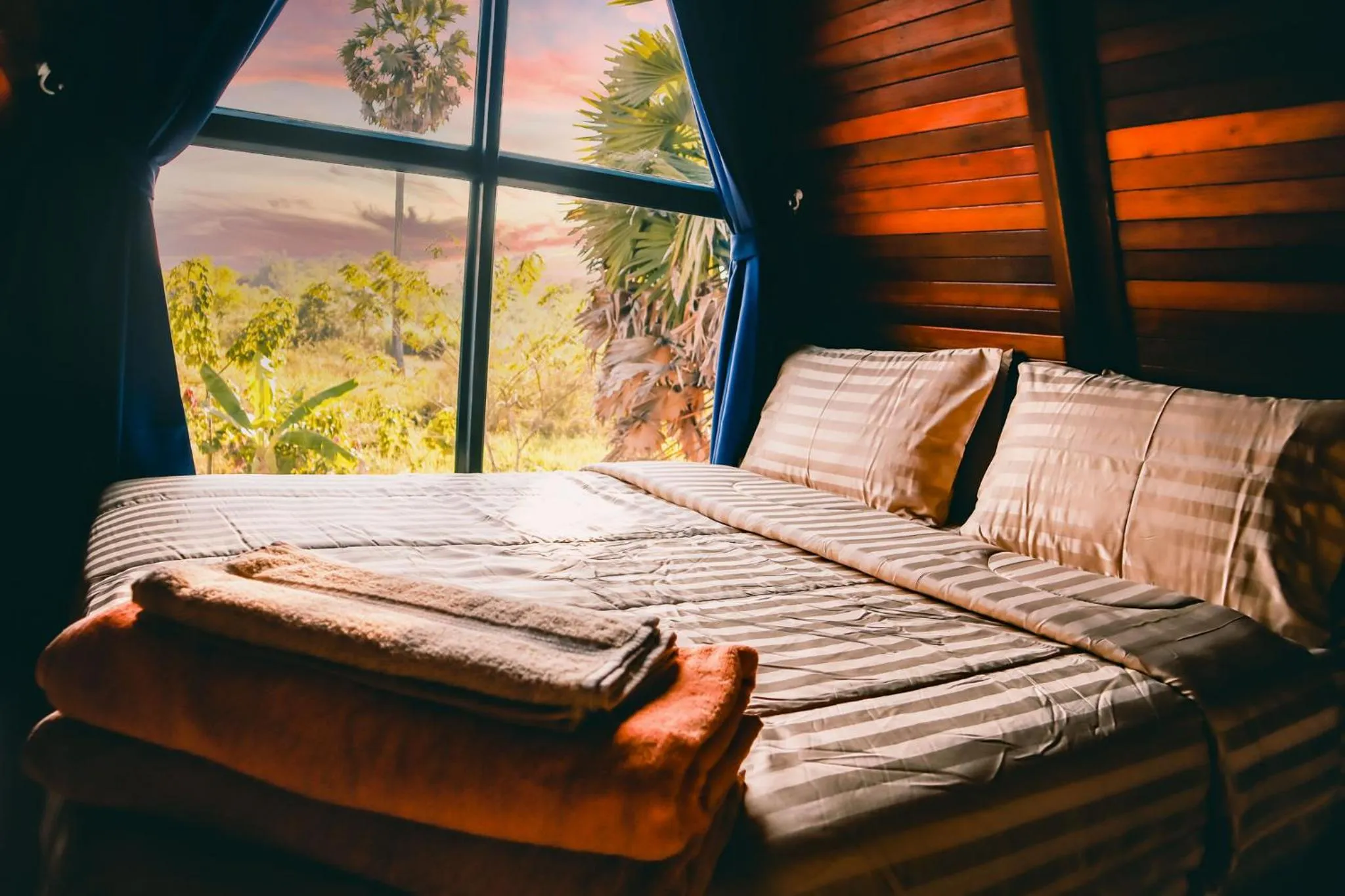 Bed in Nakara Villas & Glamping Udon Thani