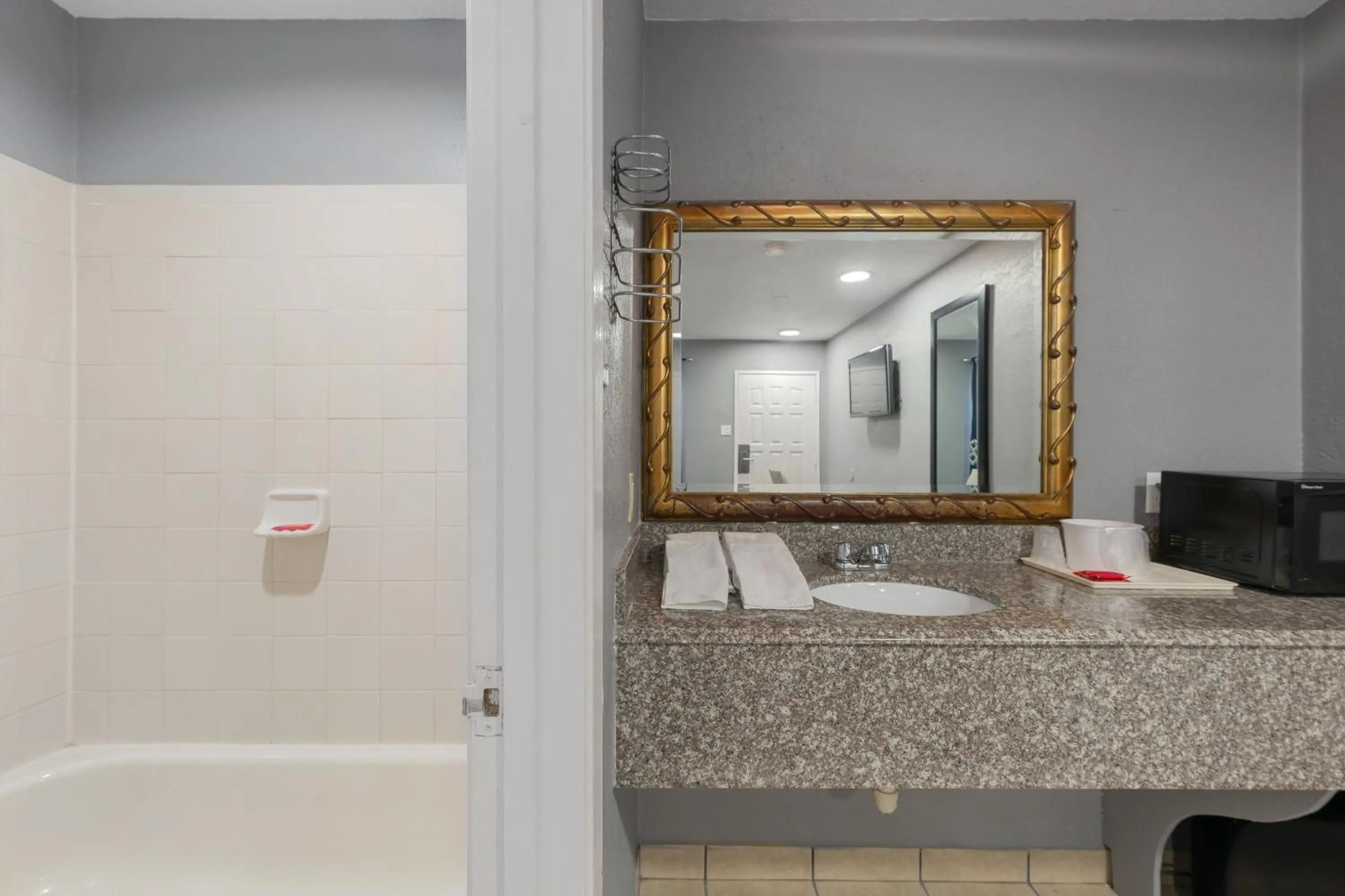 Bathroom in Golden Inn Dallas by Hotel O