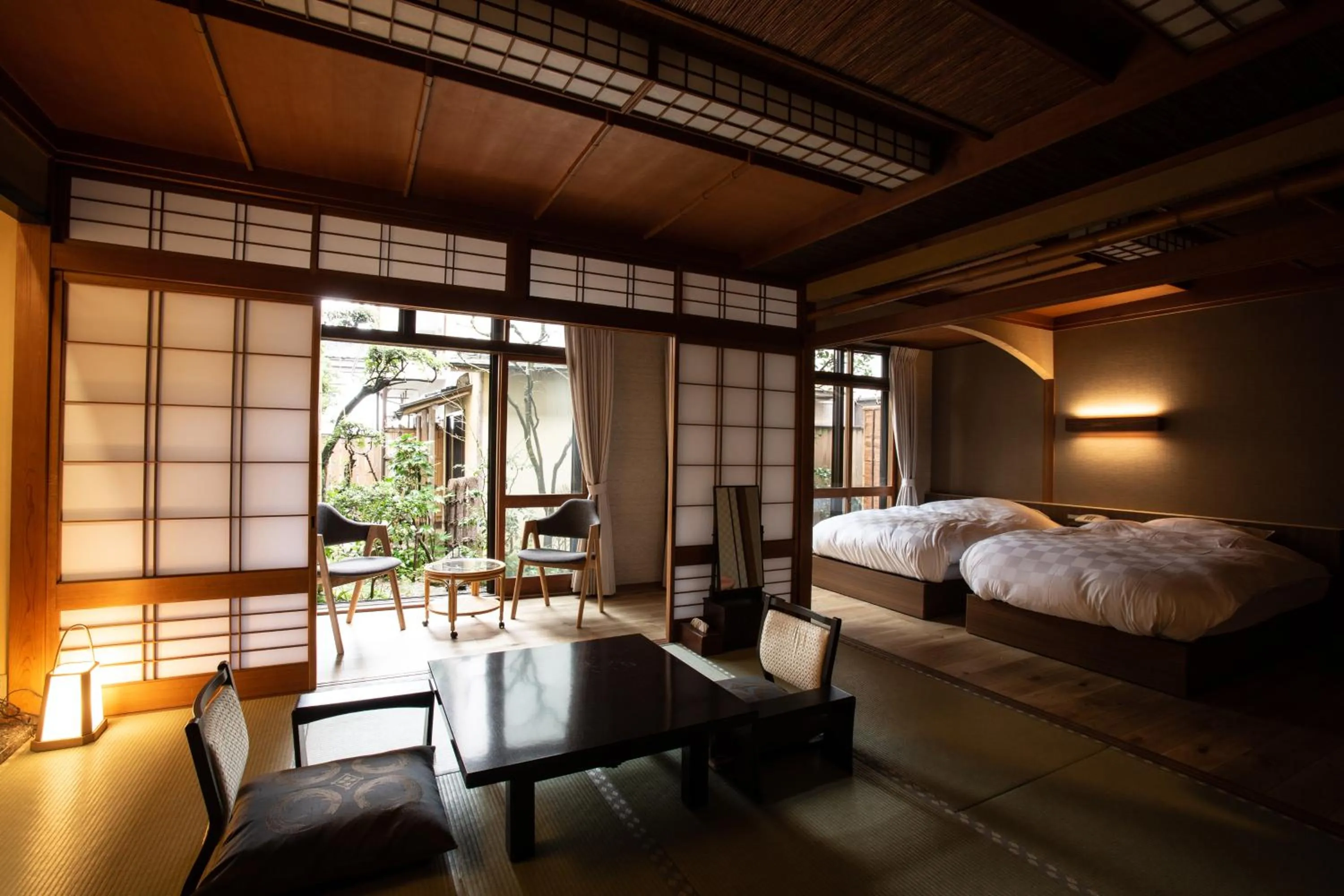 Bed in 城崎温泉 旅館 つばき乃 - Kinosaki Onsen Ryokan Tsubakino