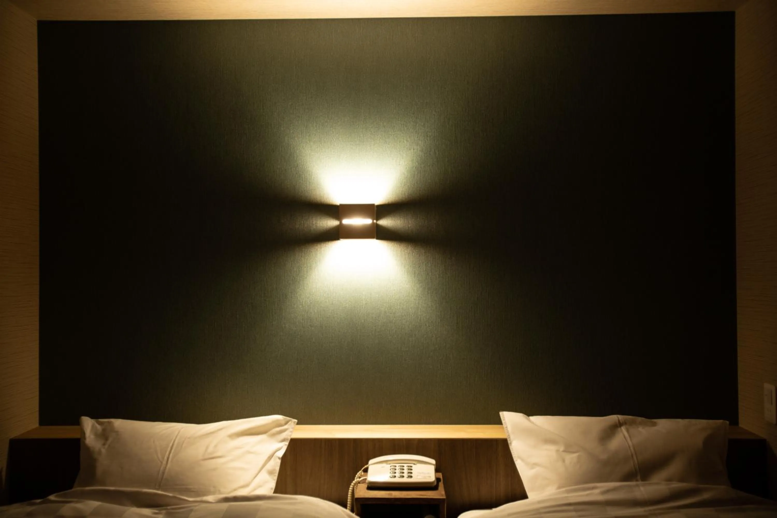 Bed in 城崎温泉 旅館 つばき乃 - Kinosaki Onsen Ryokan Tsubakino