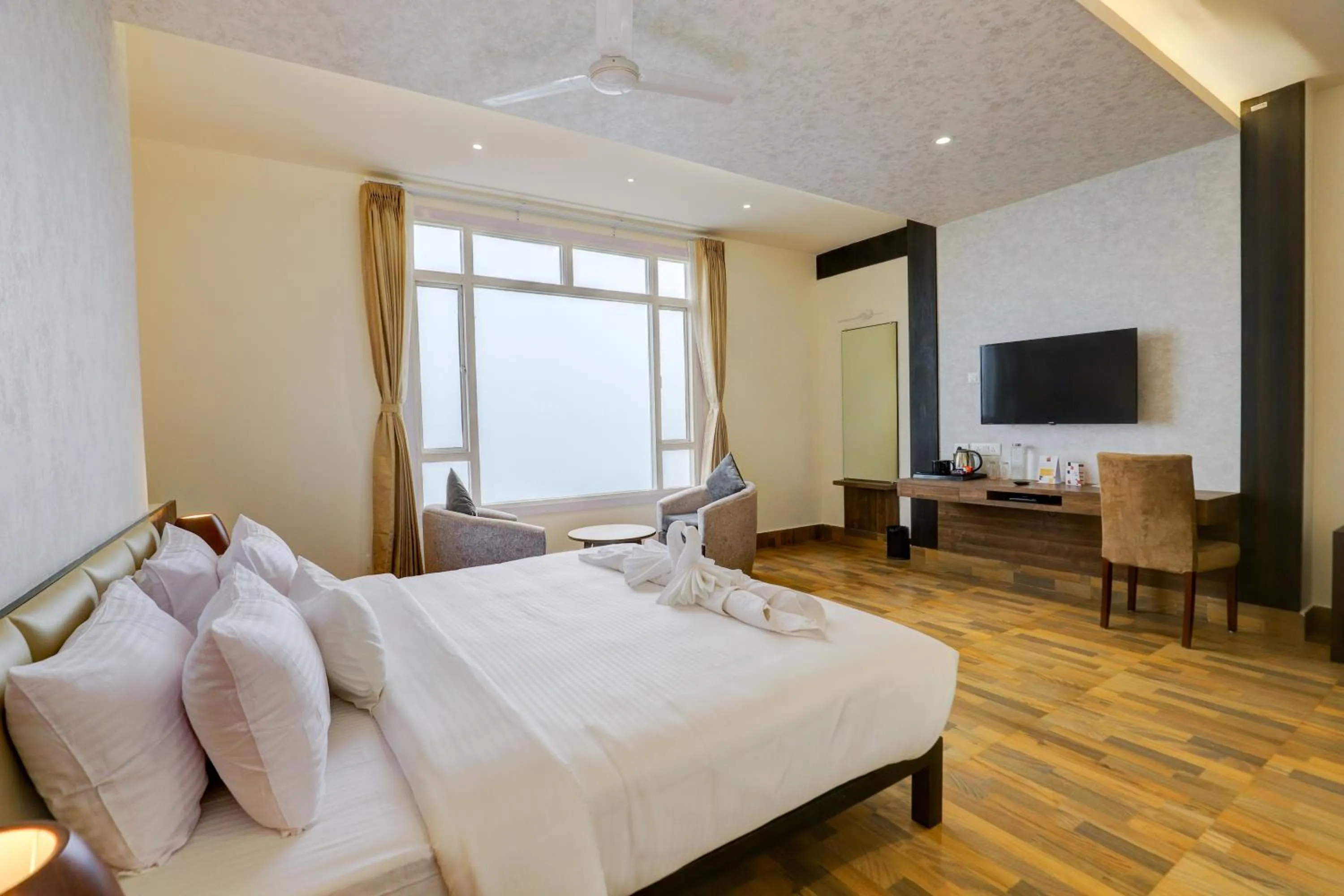 Seating area, Bed in Banari Regency by Summit