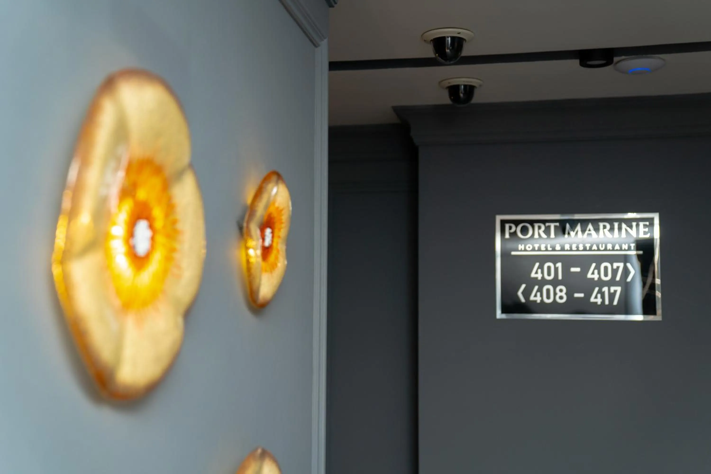 Property logo or sign in Port Marine Hotel By HOLLYWOOD