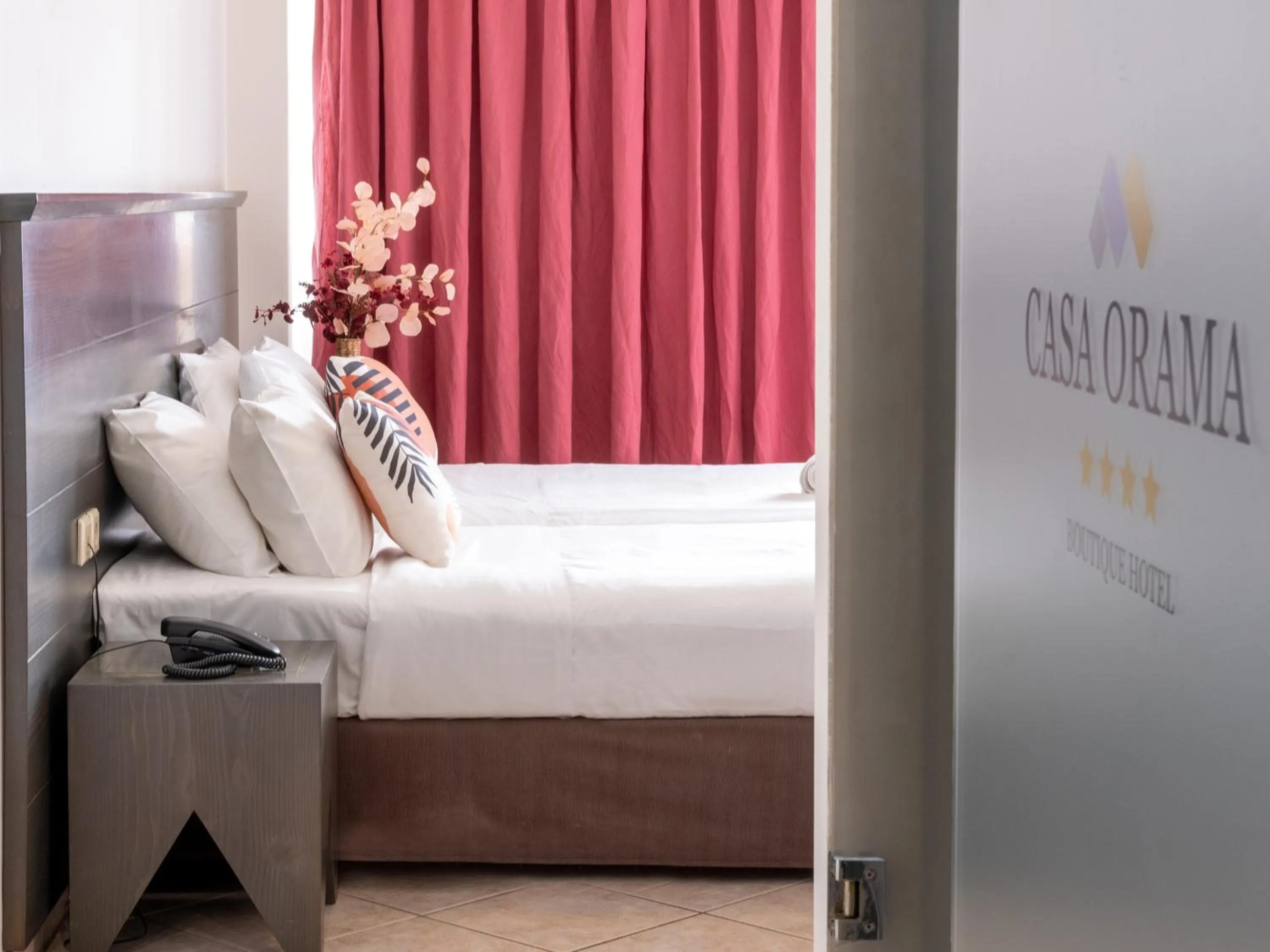 Bed in Manos Maria Hotel