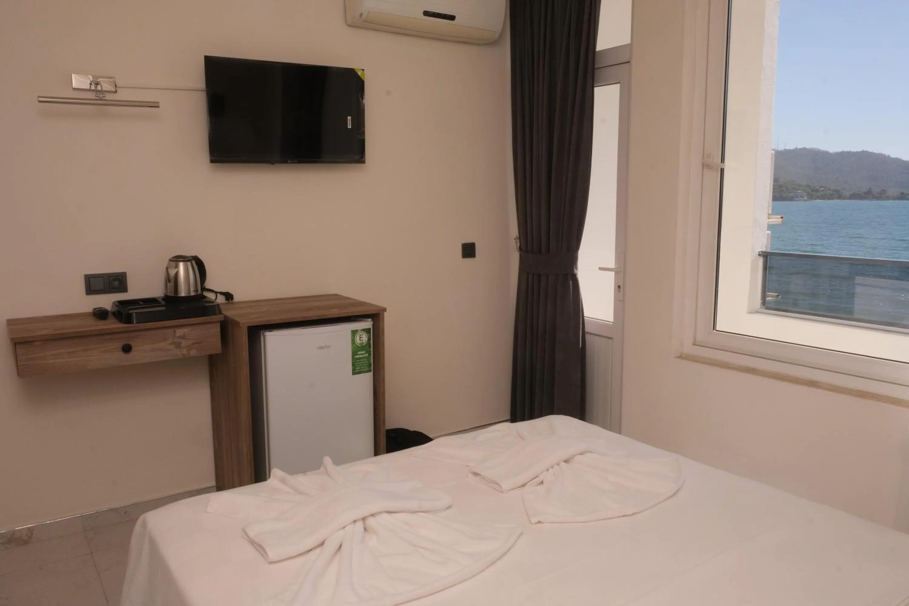 Bed in Sea Door Hotel