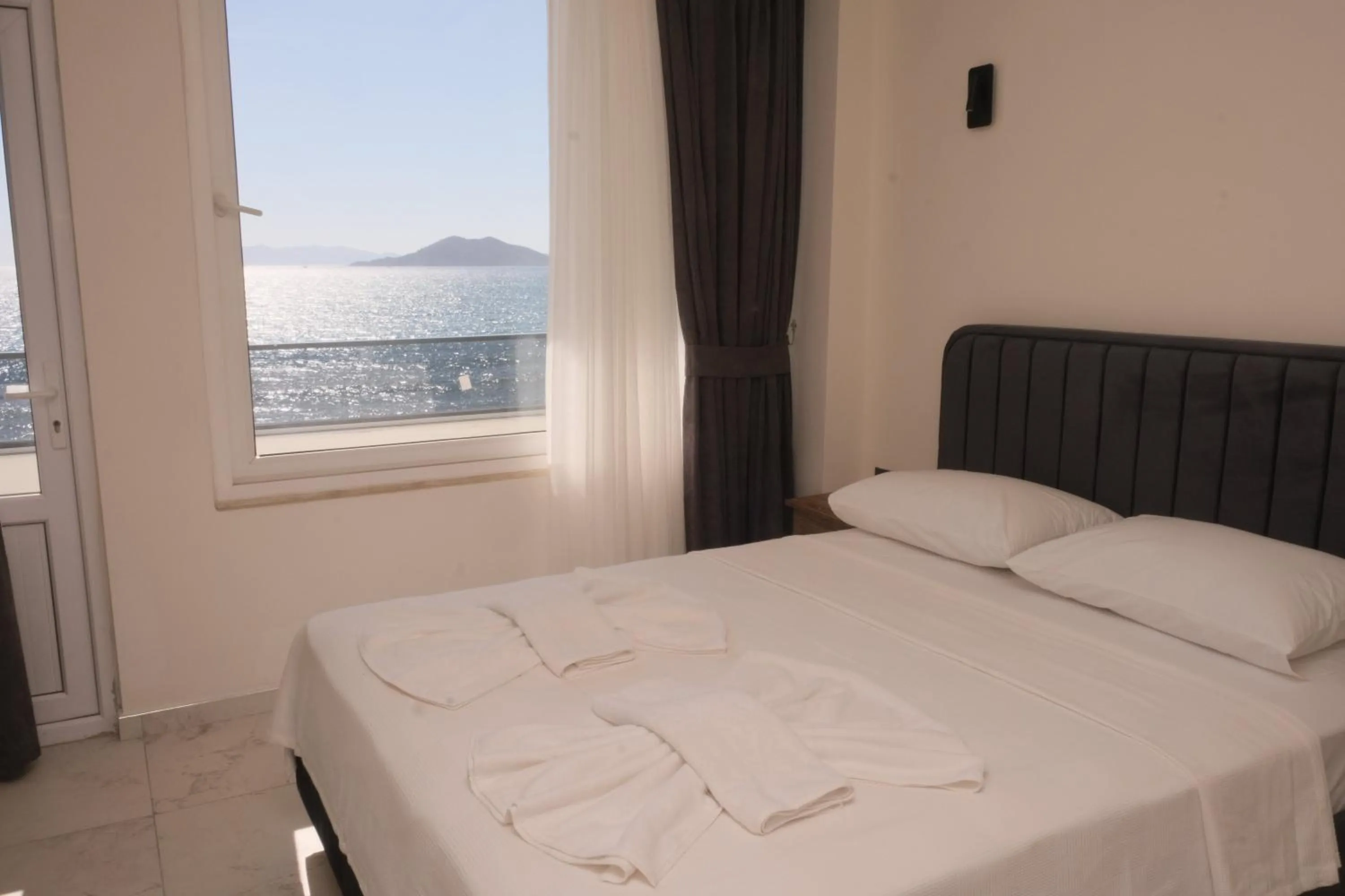 Bed in Sea Door Hotel