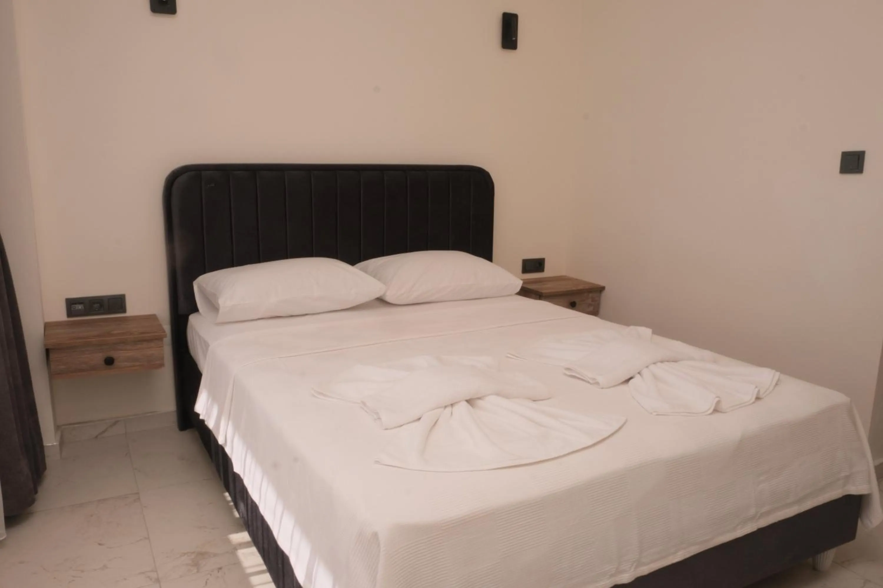 Bed in Sea Door Hotel