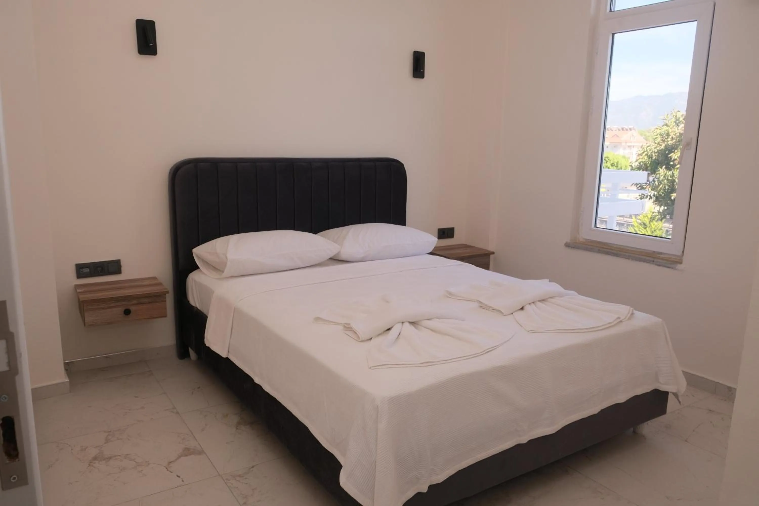 Bed in Sea Door Hotel