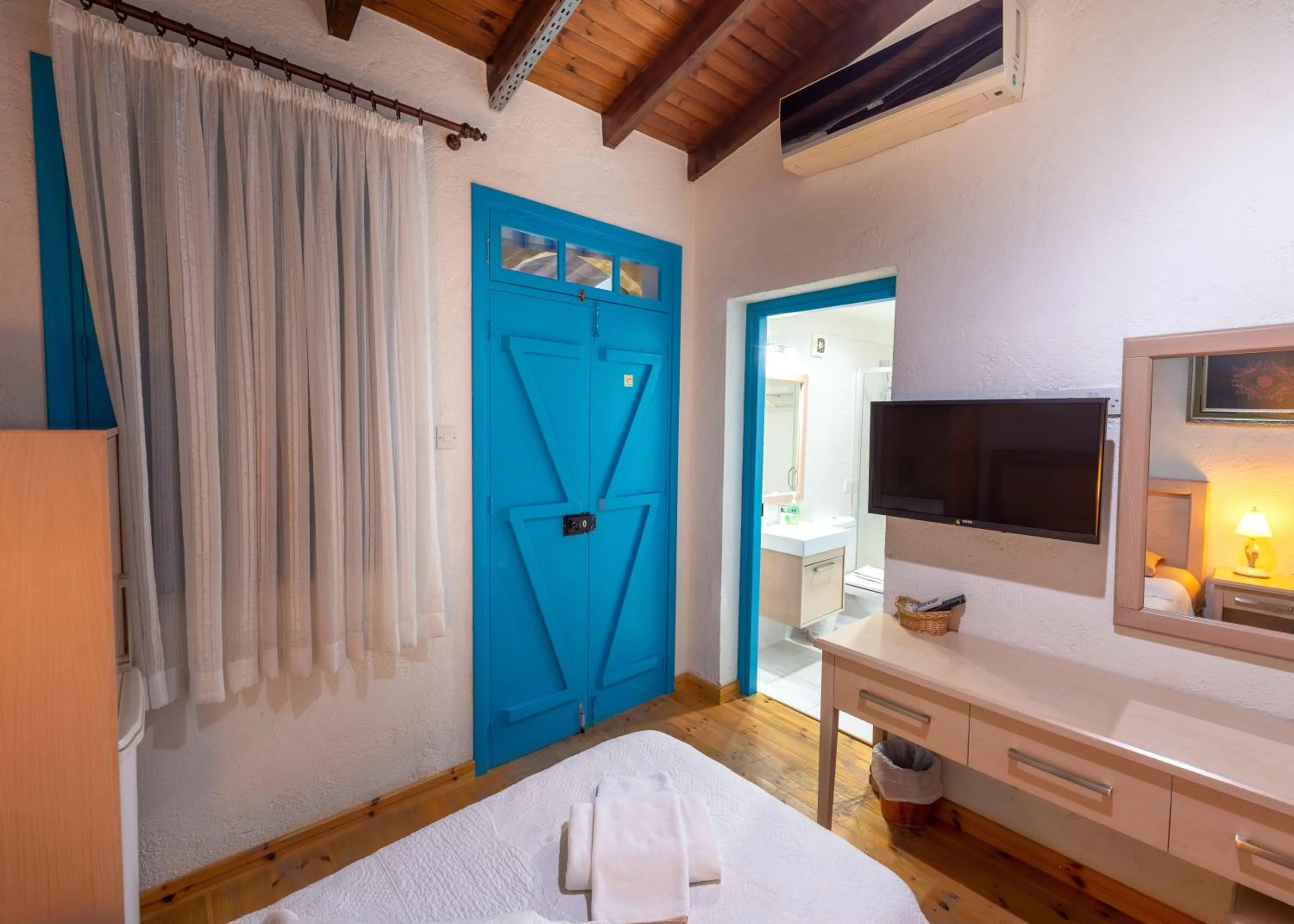 Bed in Cypriot Swallow Boutique Hotel