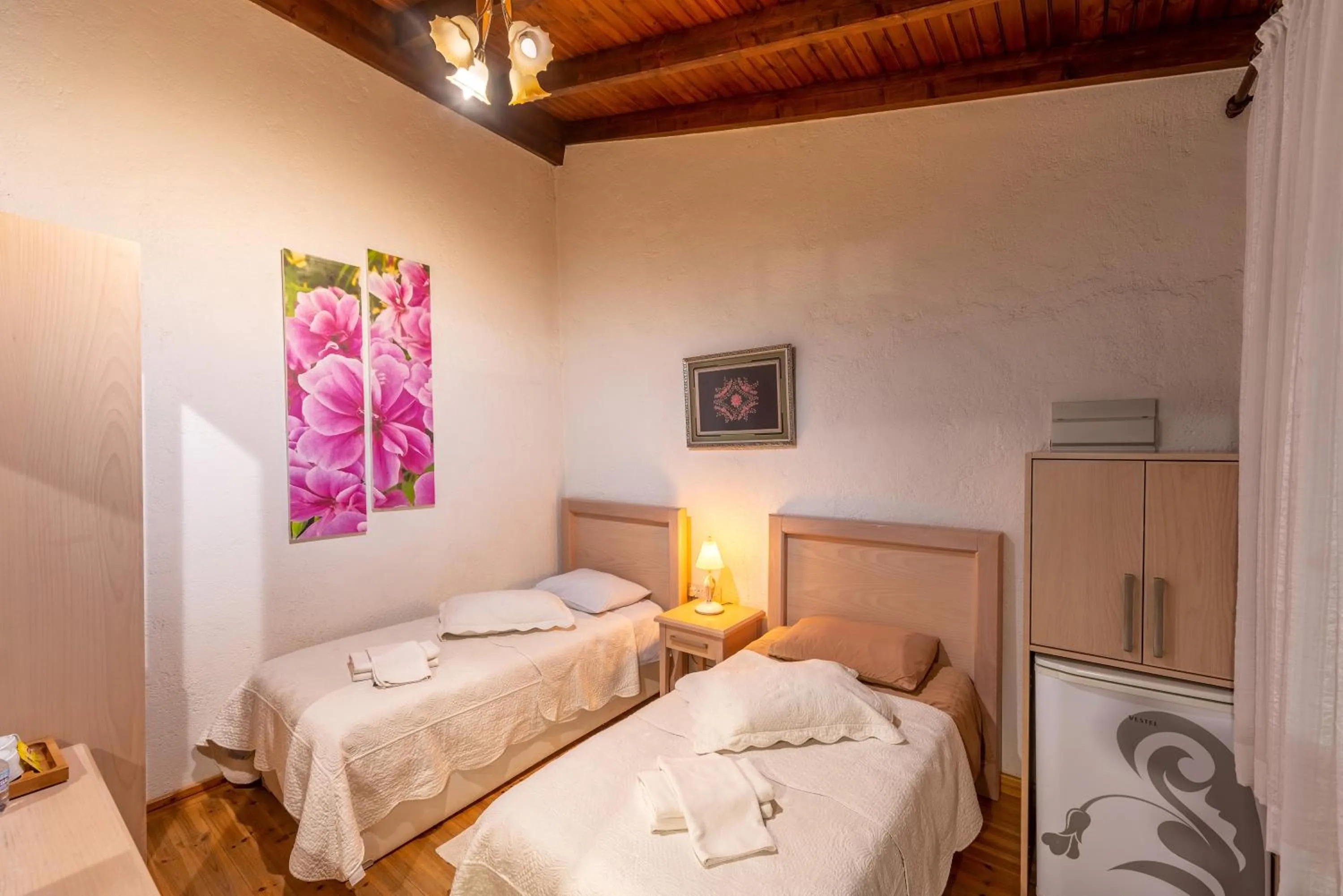 Bed in Cypriot Swallow Boutique Hotel