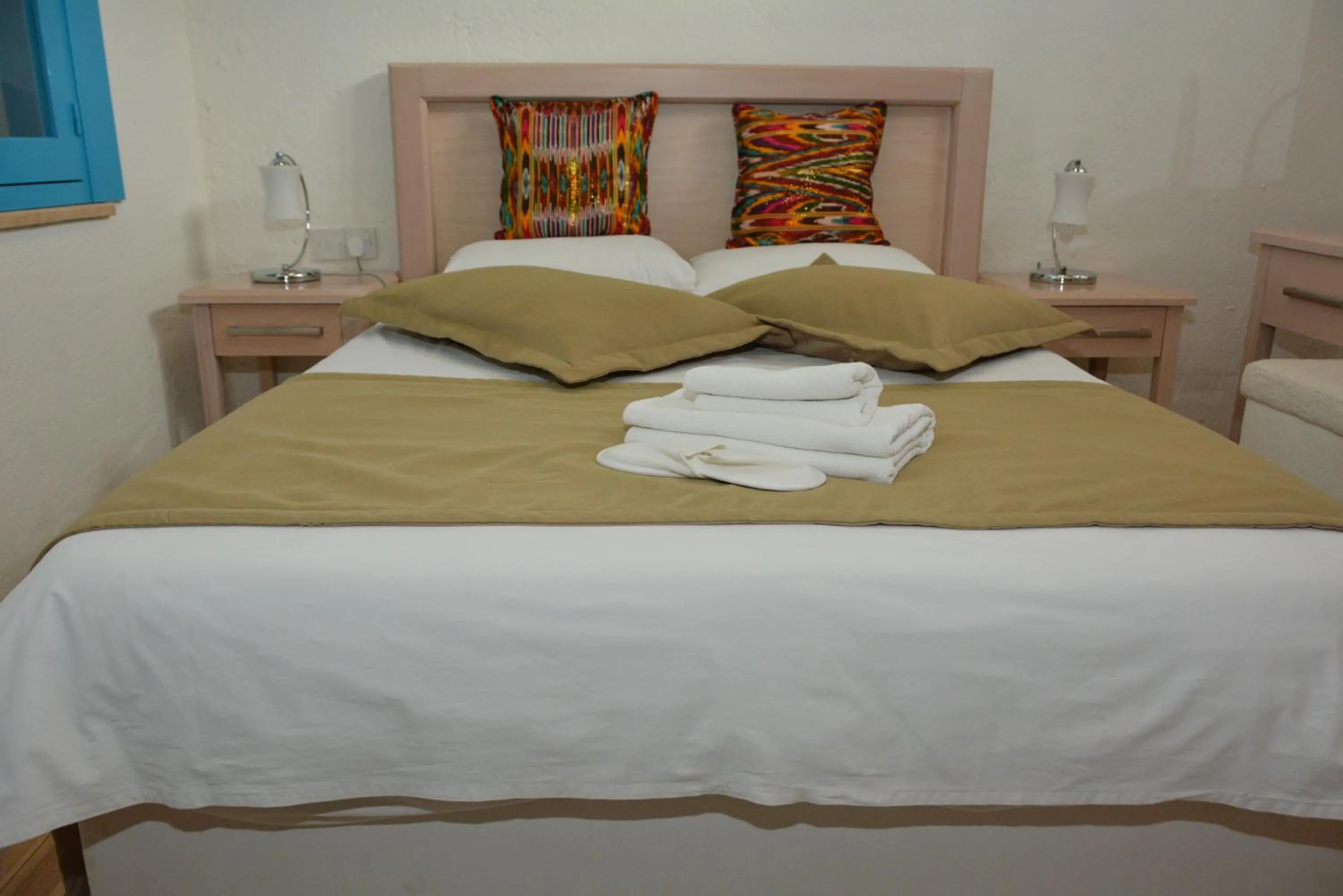 Bed in Cypriot Swallow Boutique Hotel