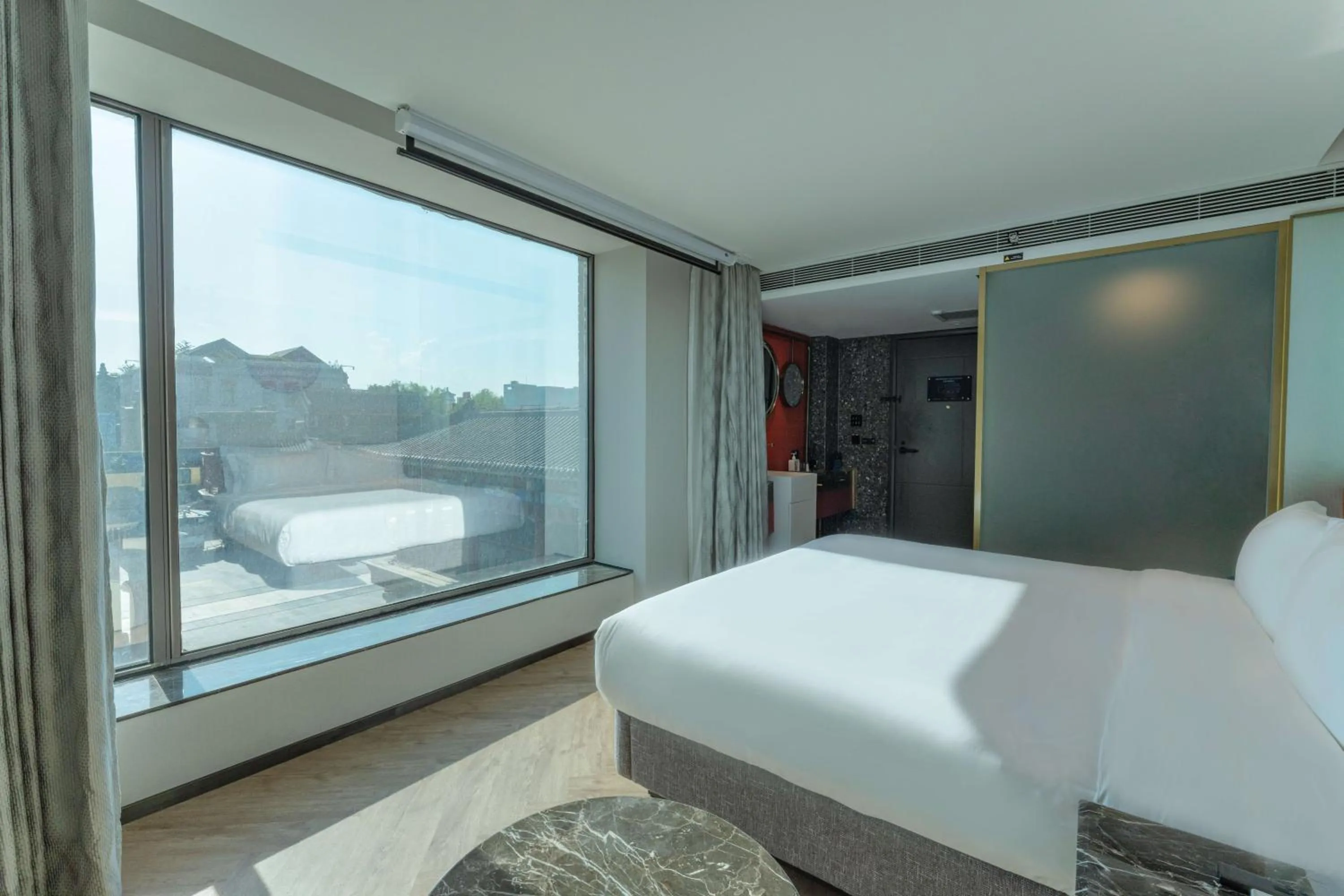 Bed in M Hotel - Beijing Tiananmen Square Qianmen Subway Station