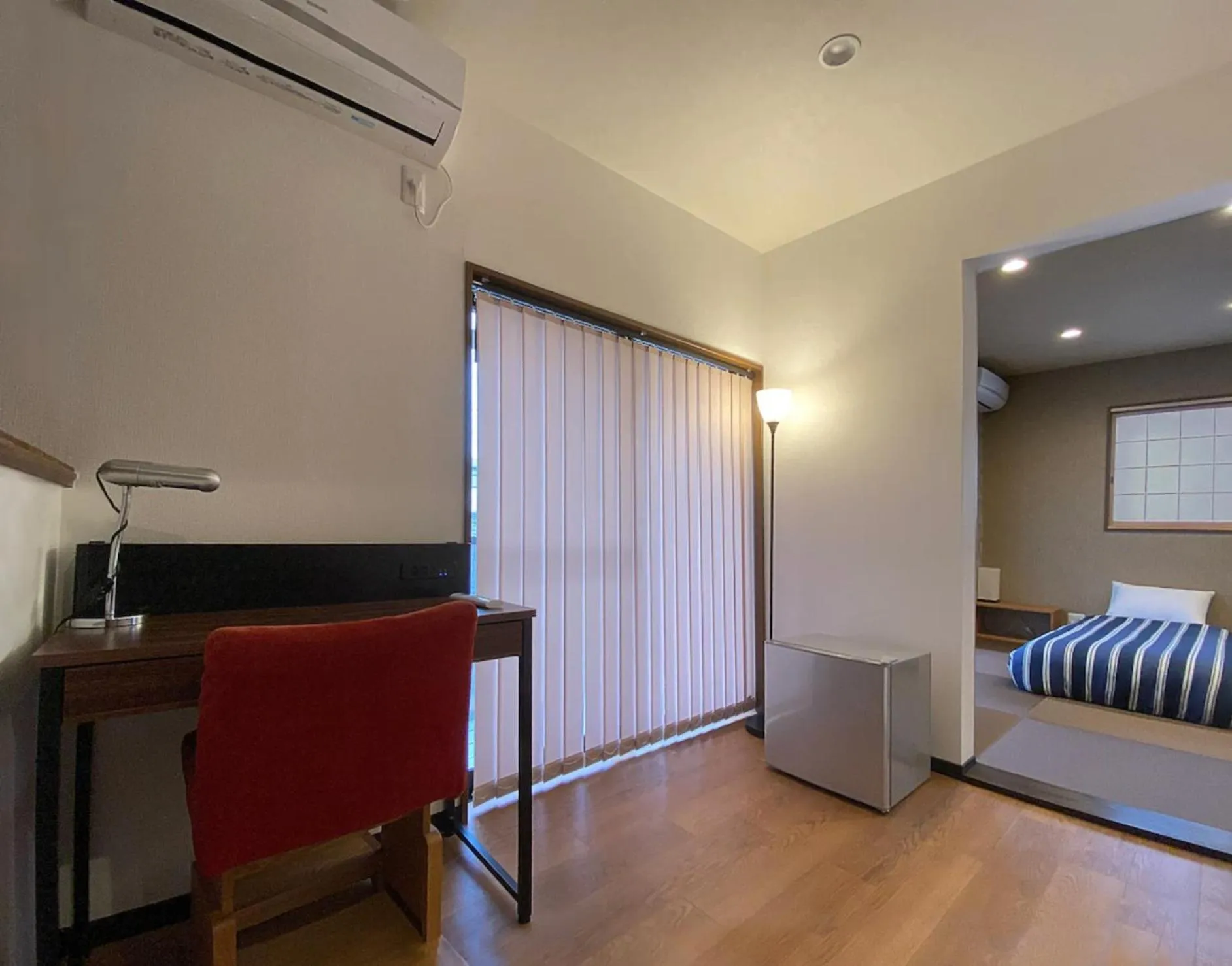 Seating area, Bed in My Home Inn Izumisano