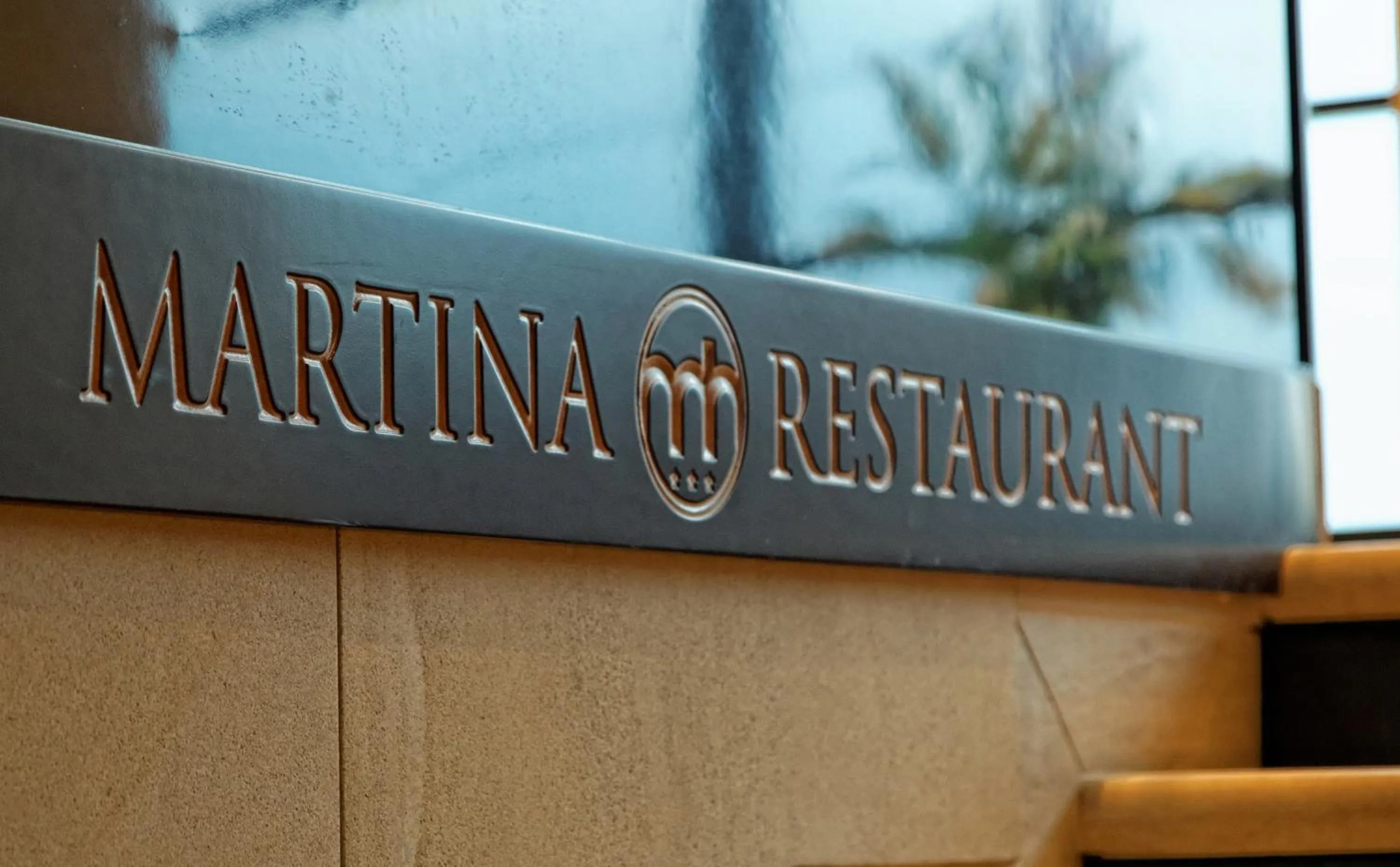 Property logo or sign in Hotel Martina