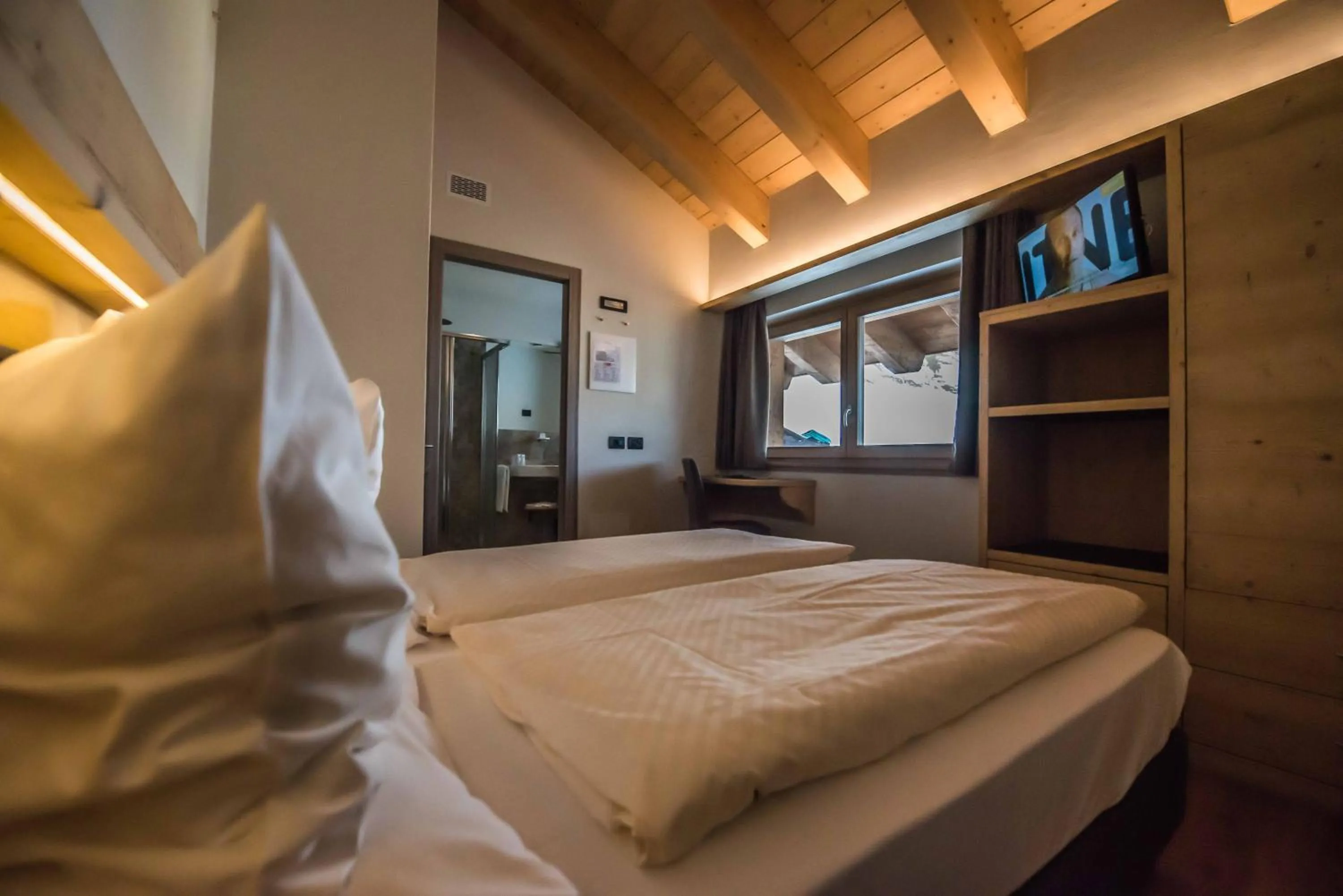 Bed in Hotel Le Alpi