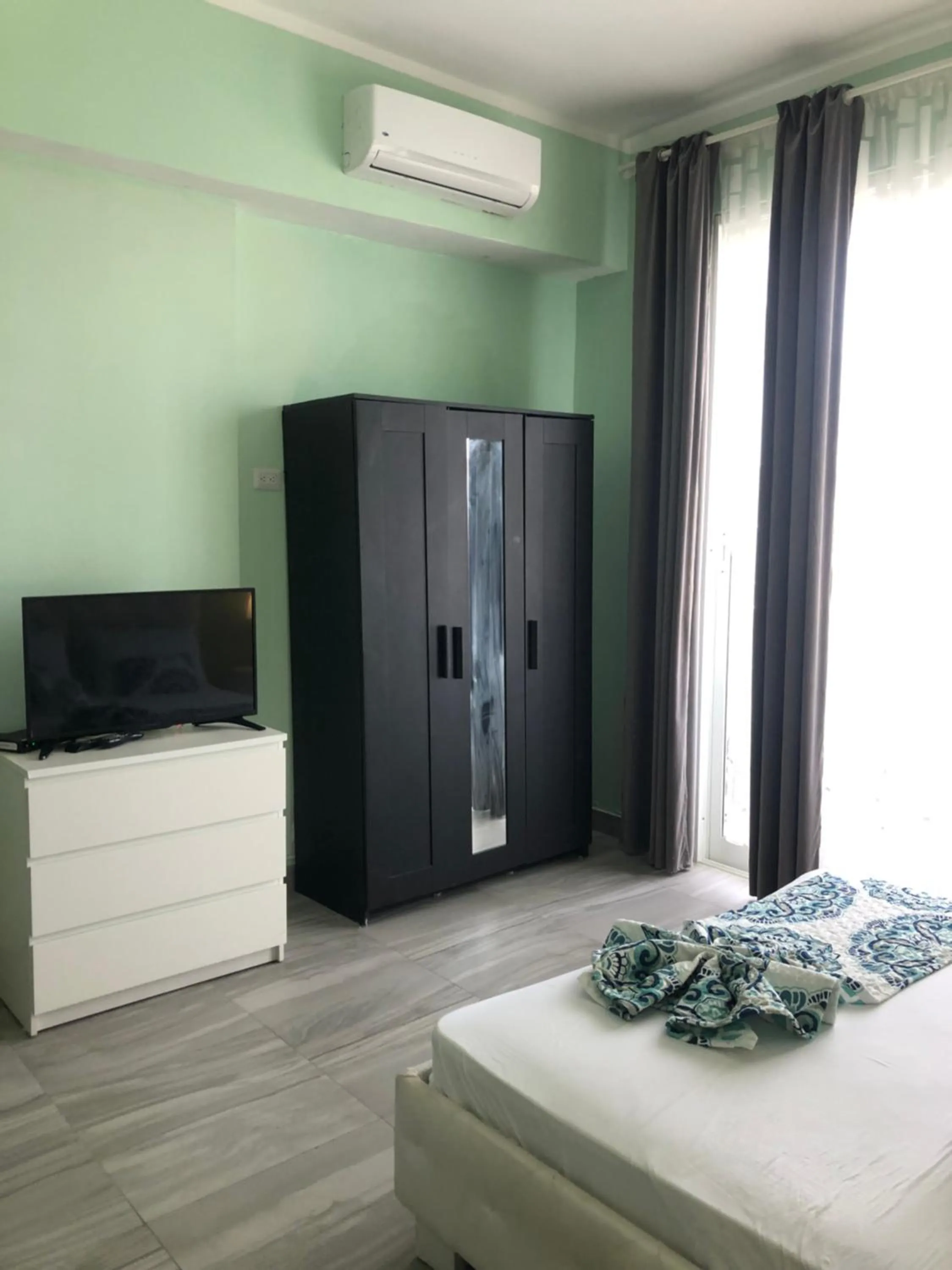 TV/Entertainment Center in Ducassi Rooftop Pool Suites Beach Club and SPA