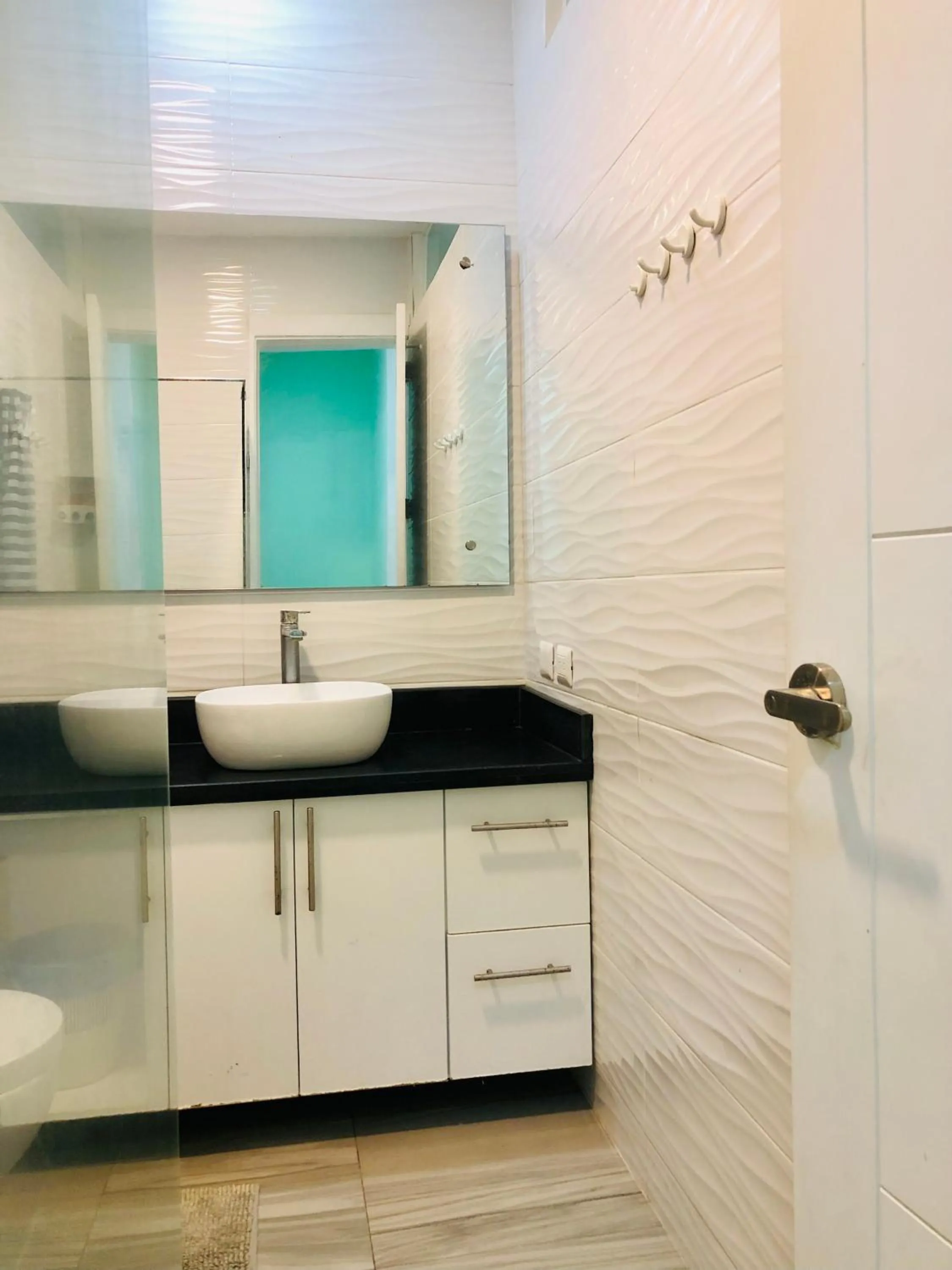 Bathroom in Ducassi Rooftop Pool Suites Beach Club and SPA