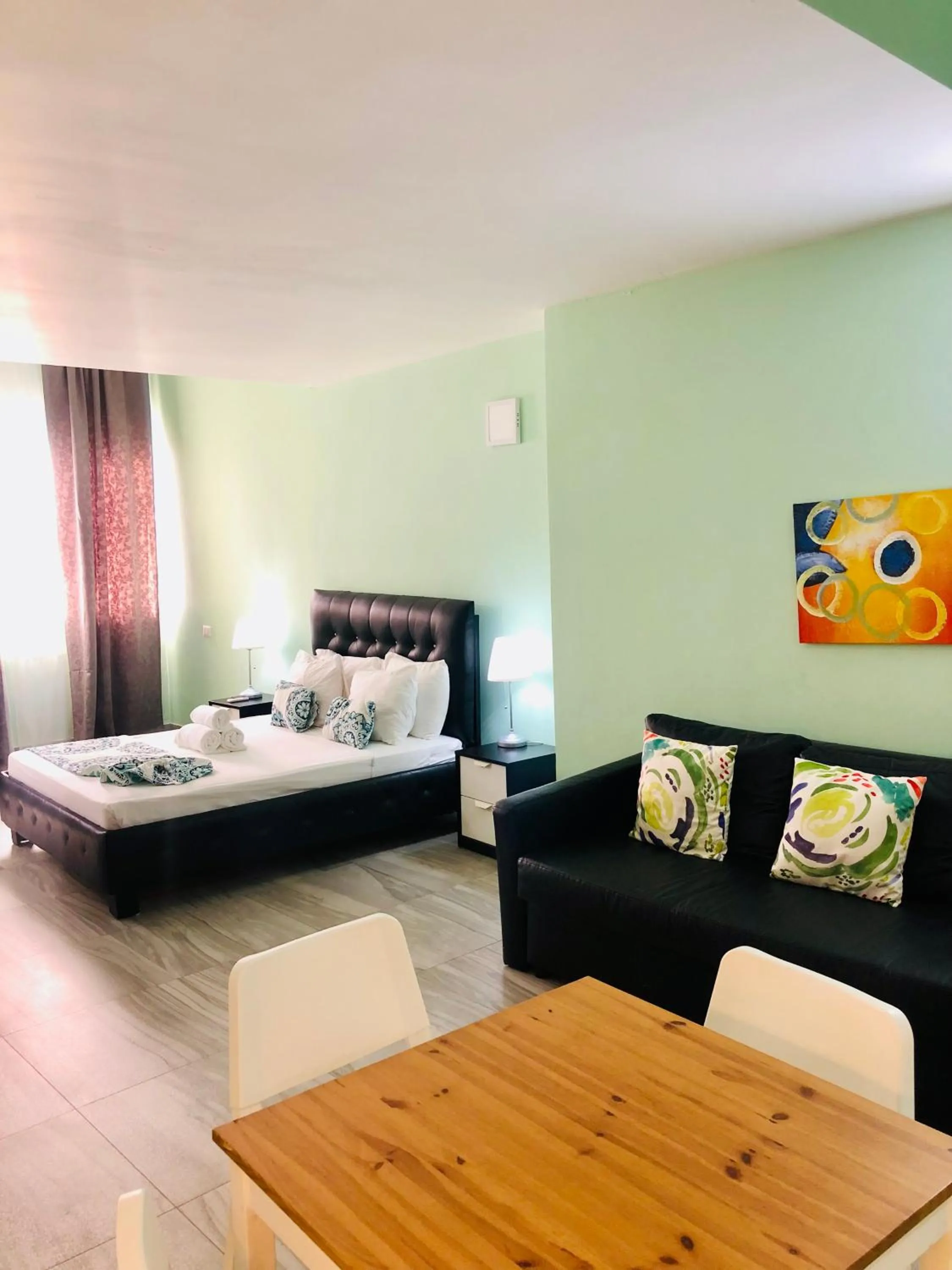 Bed in Ducassi Rooftop Pool Suites Beach Club and SPA