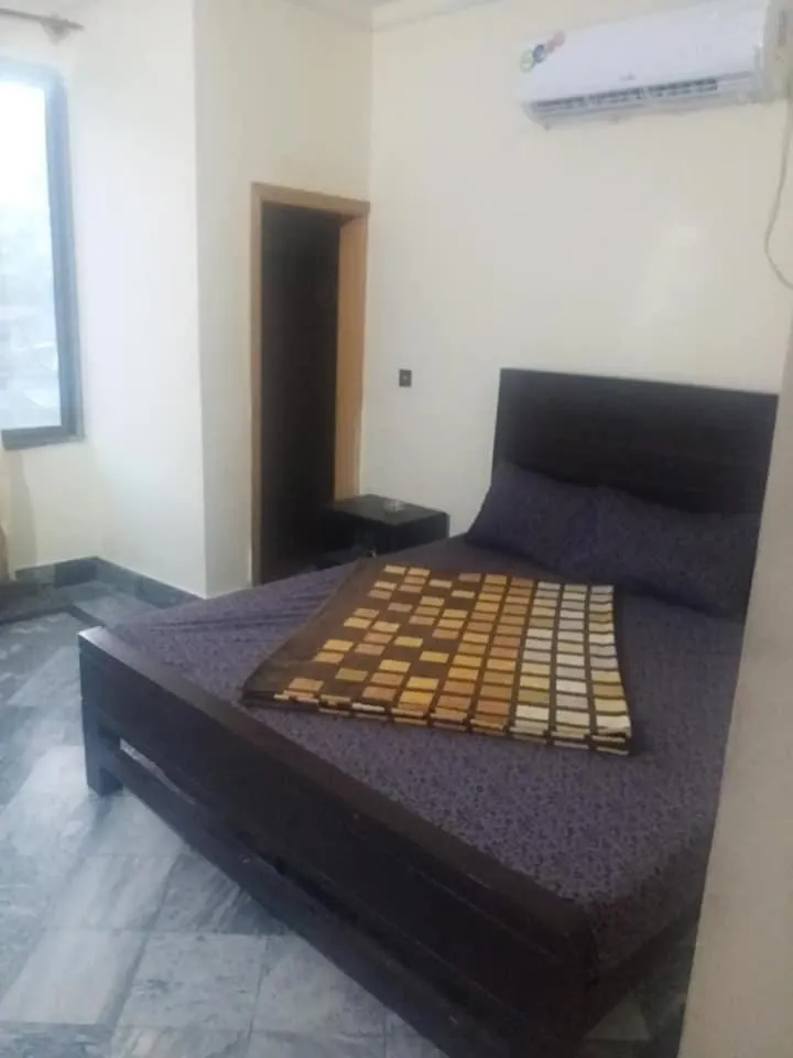 Bed in Kashmir Inn Hotel