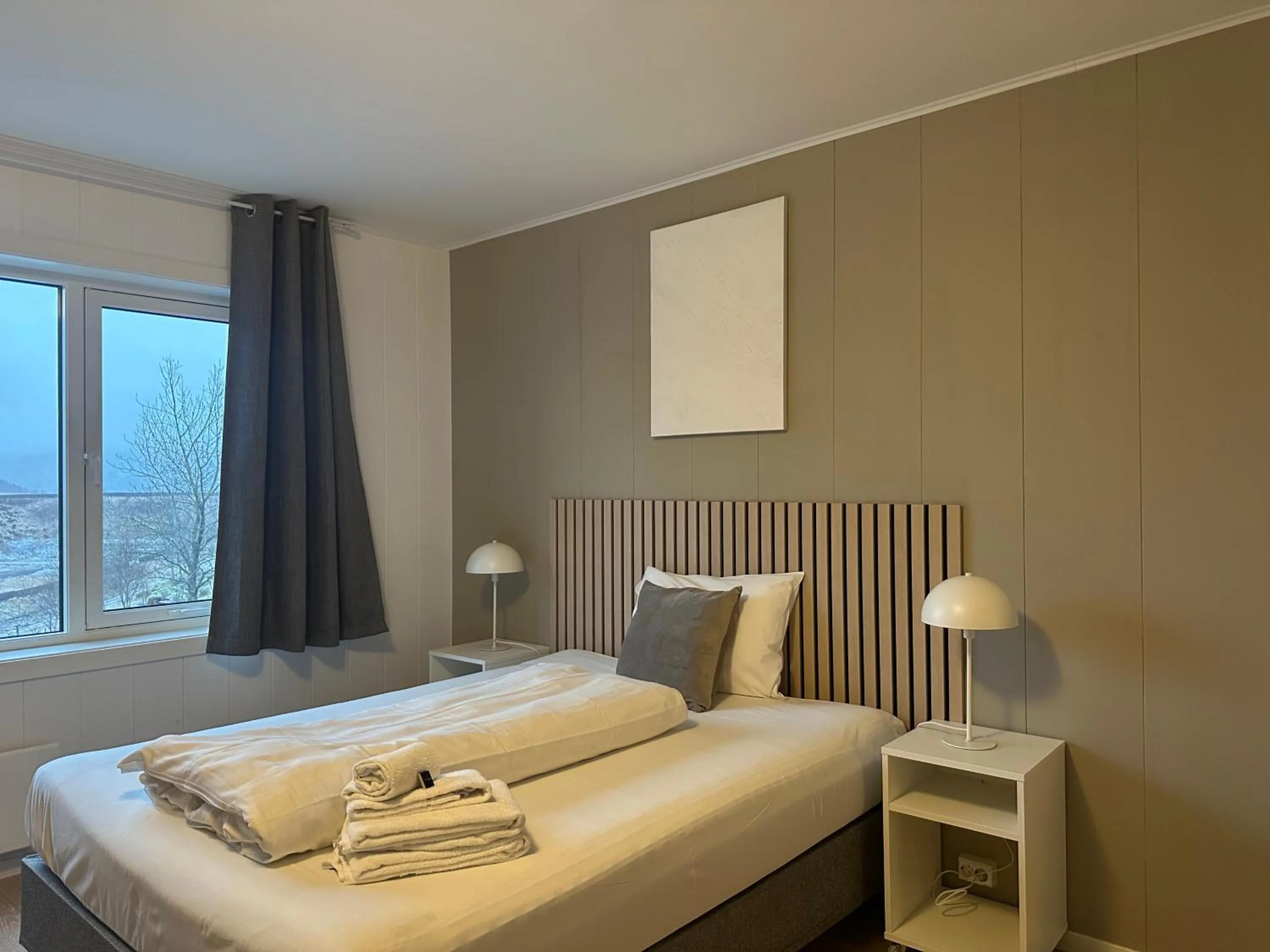 Bed in Selvbetjent leilighetshotell på Ålgård