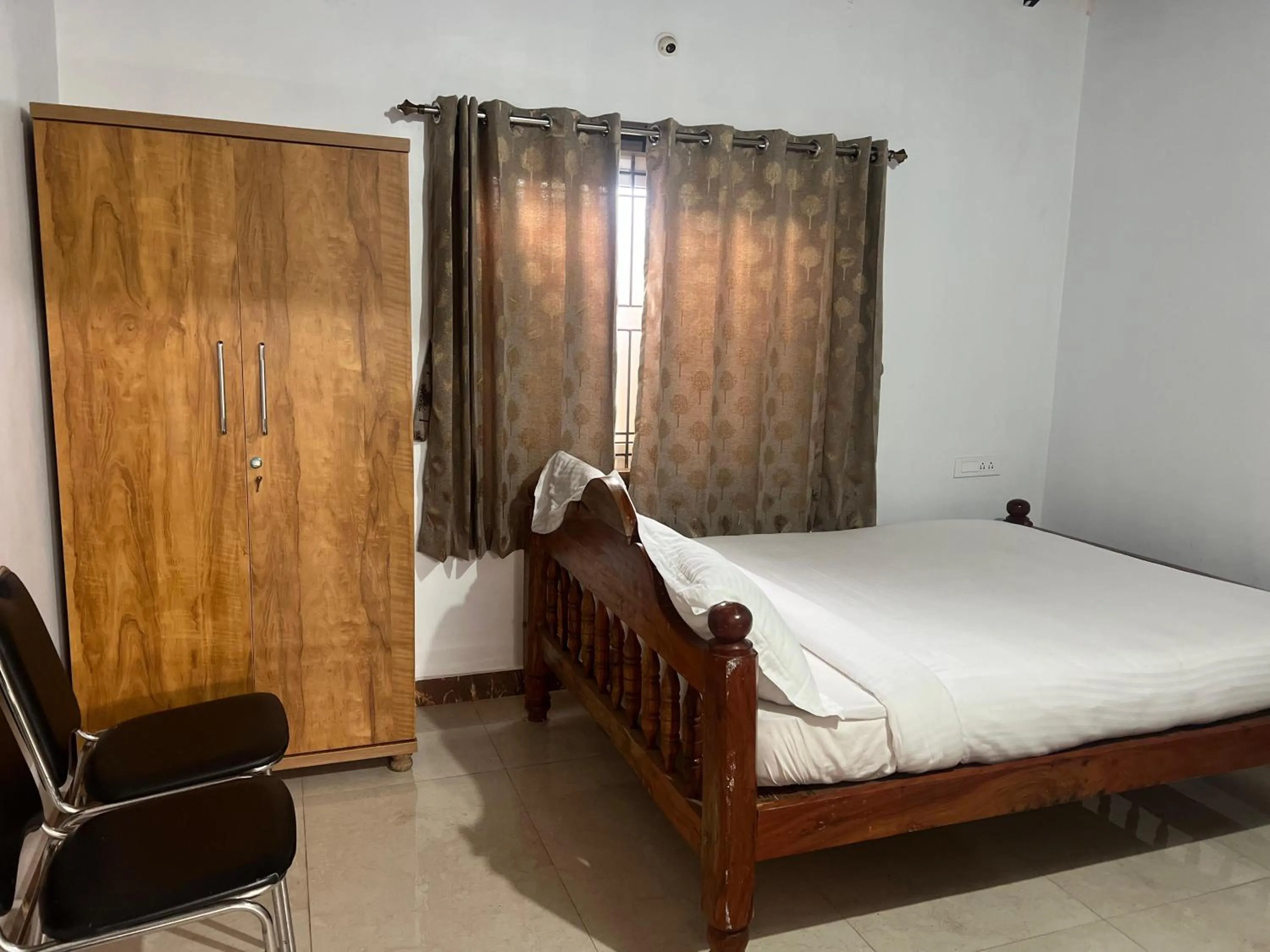 Bed in Poojaris Nirantara - Mysuru