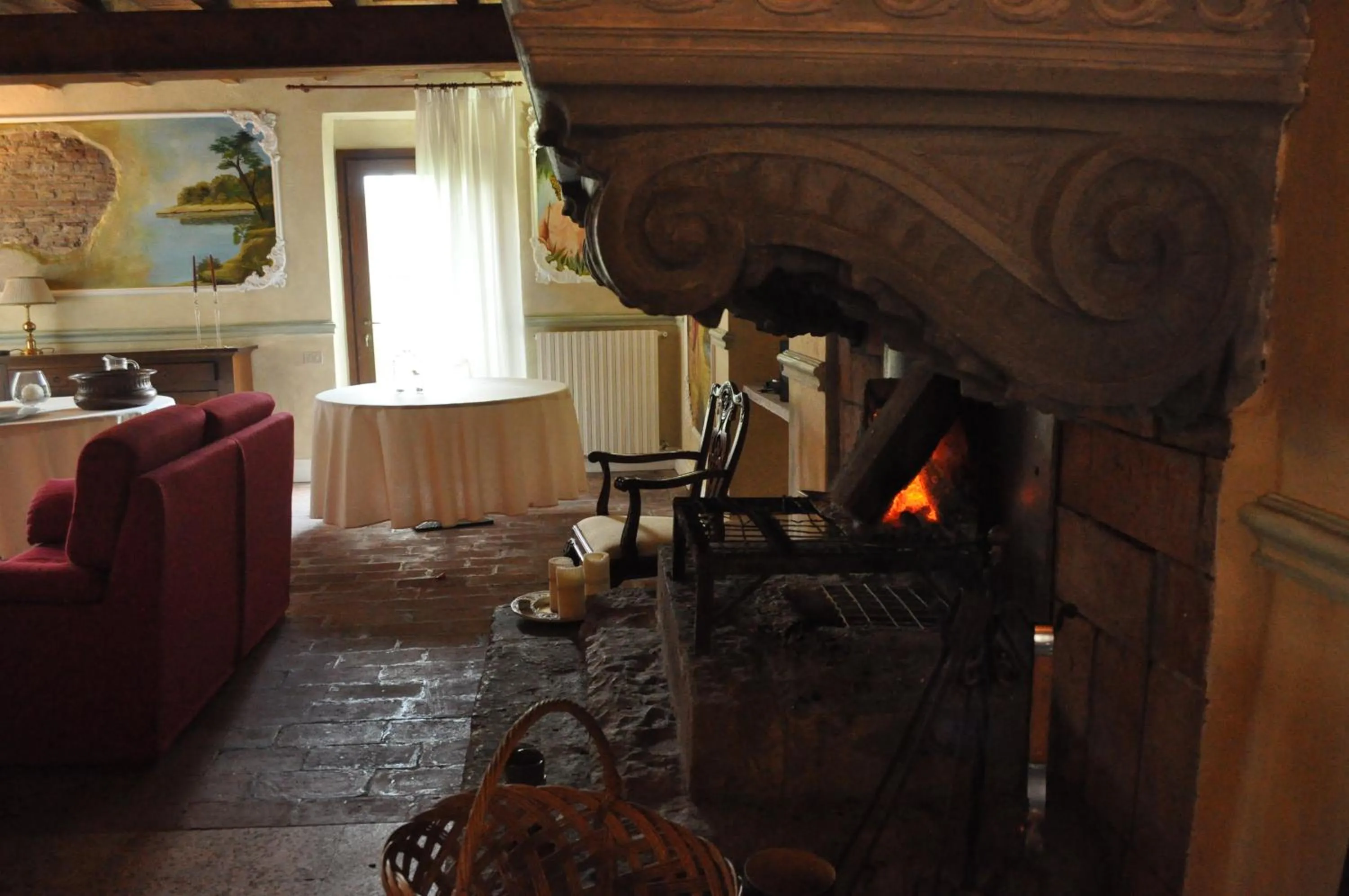 Communal lounge/ TV room in Le Residenze del Tenore