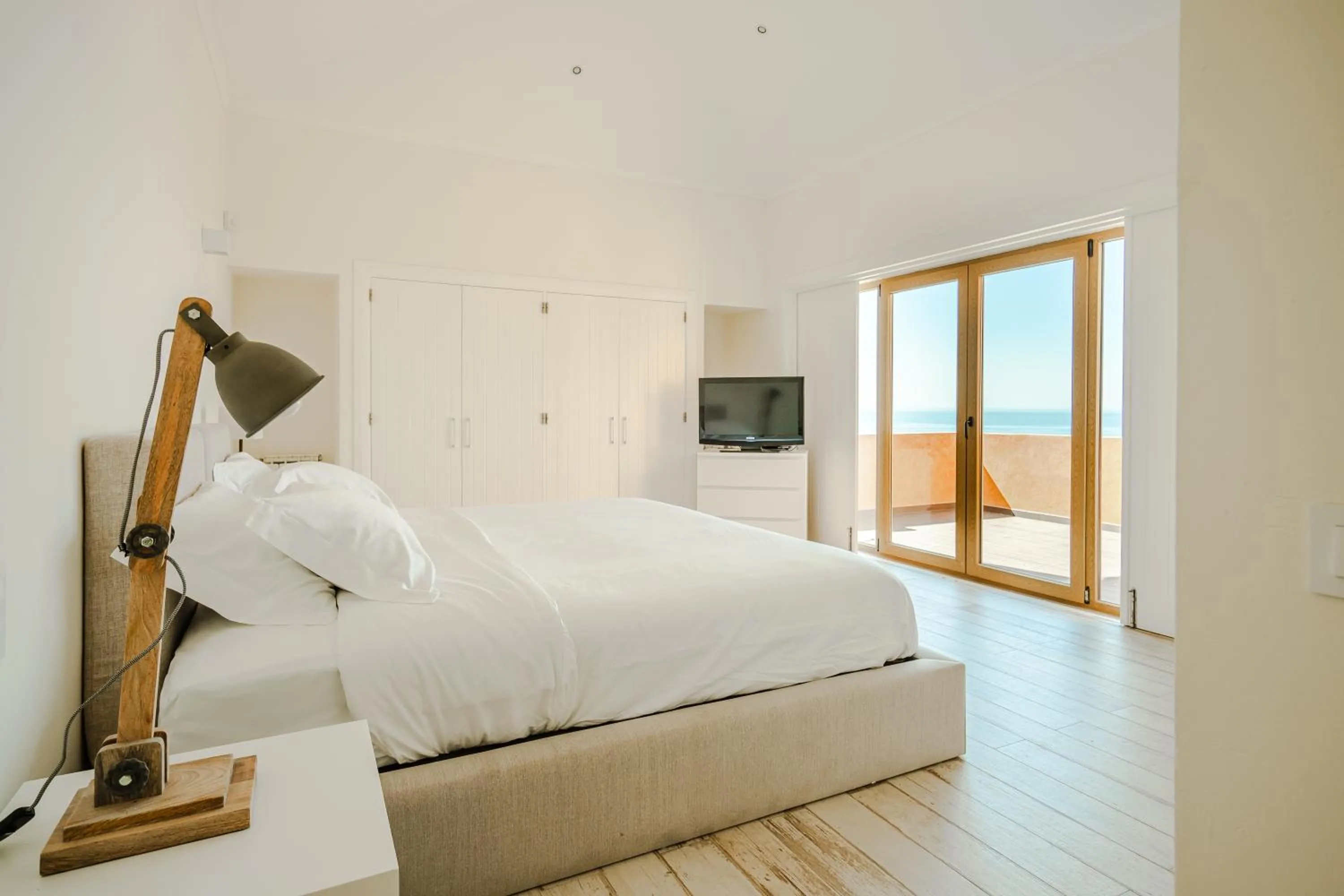 Bed in Casa Pôr do Sal - Boutique Guesthouse with Heated Pool & Sea Views