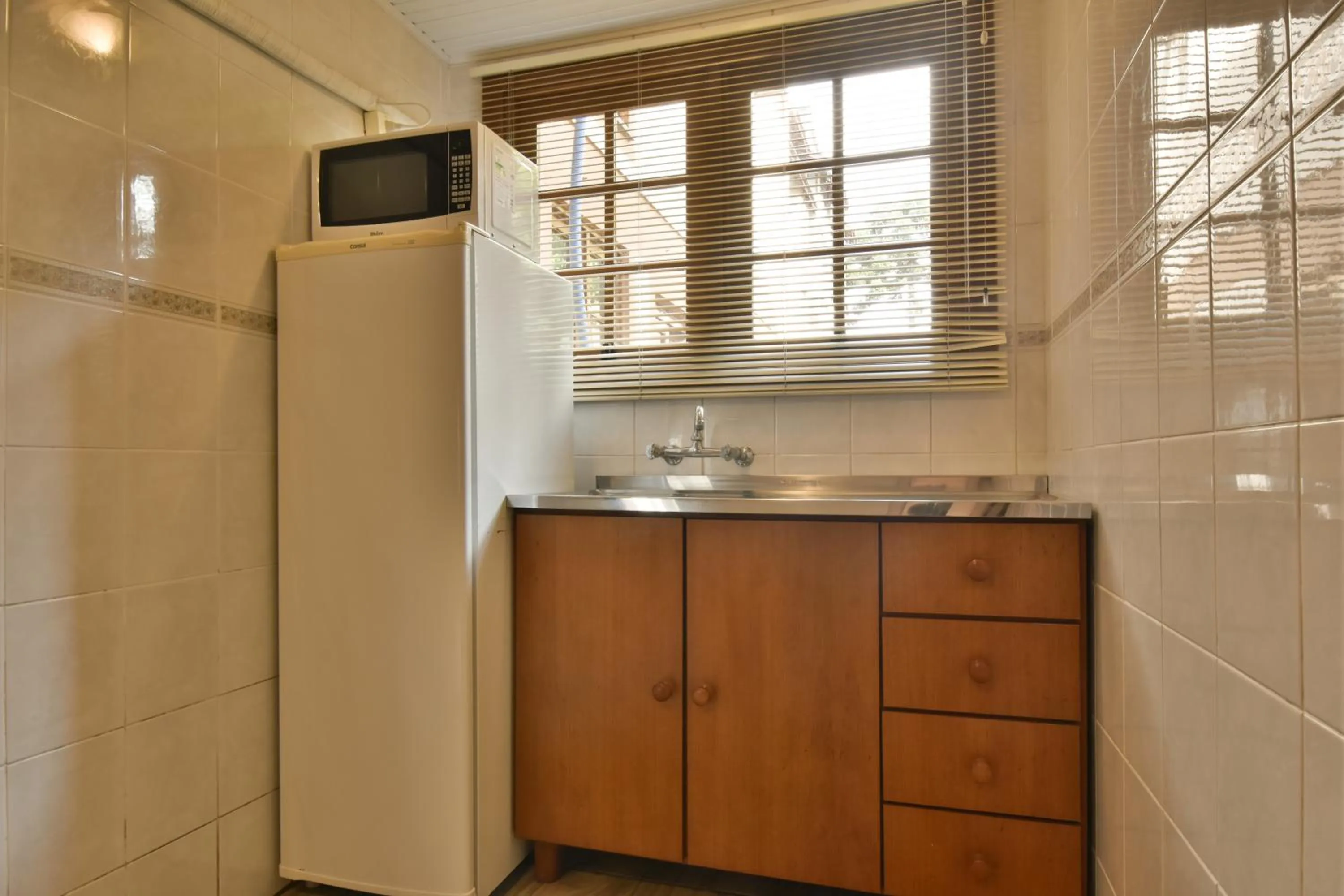 Kitchen or kitchenette in Pousada Stillo Gramado