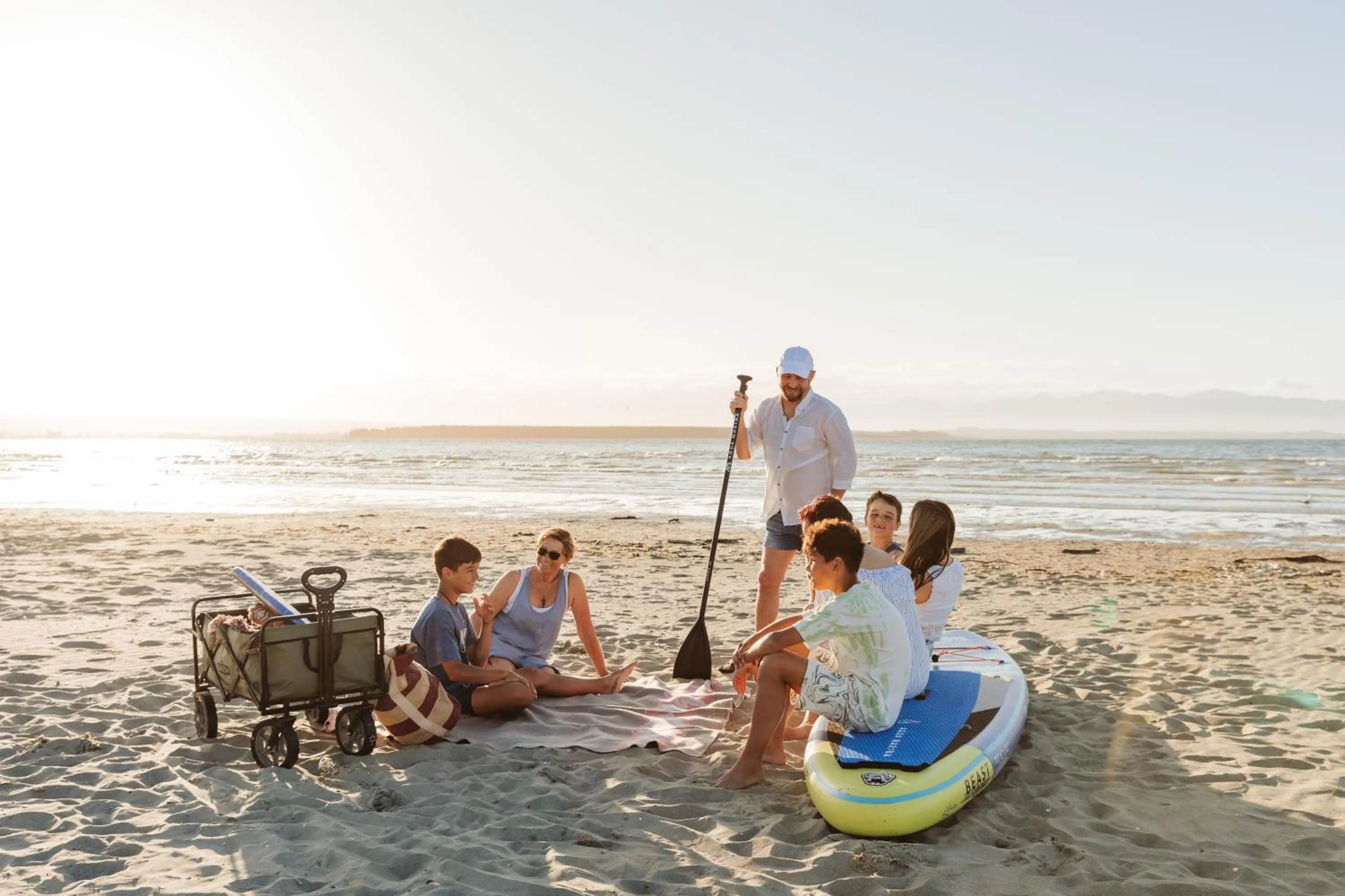 People in Tāhuna Beach Holiday Park