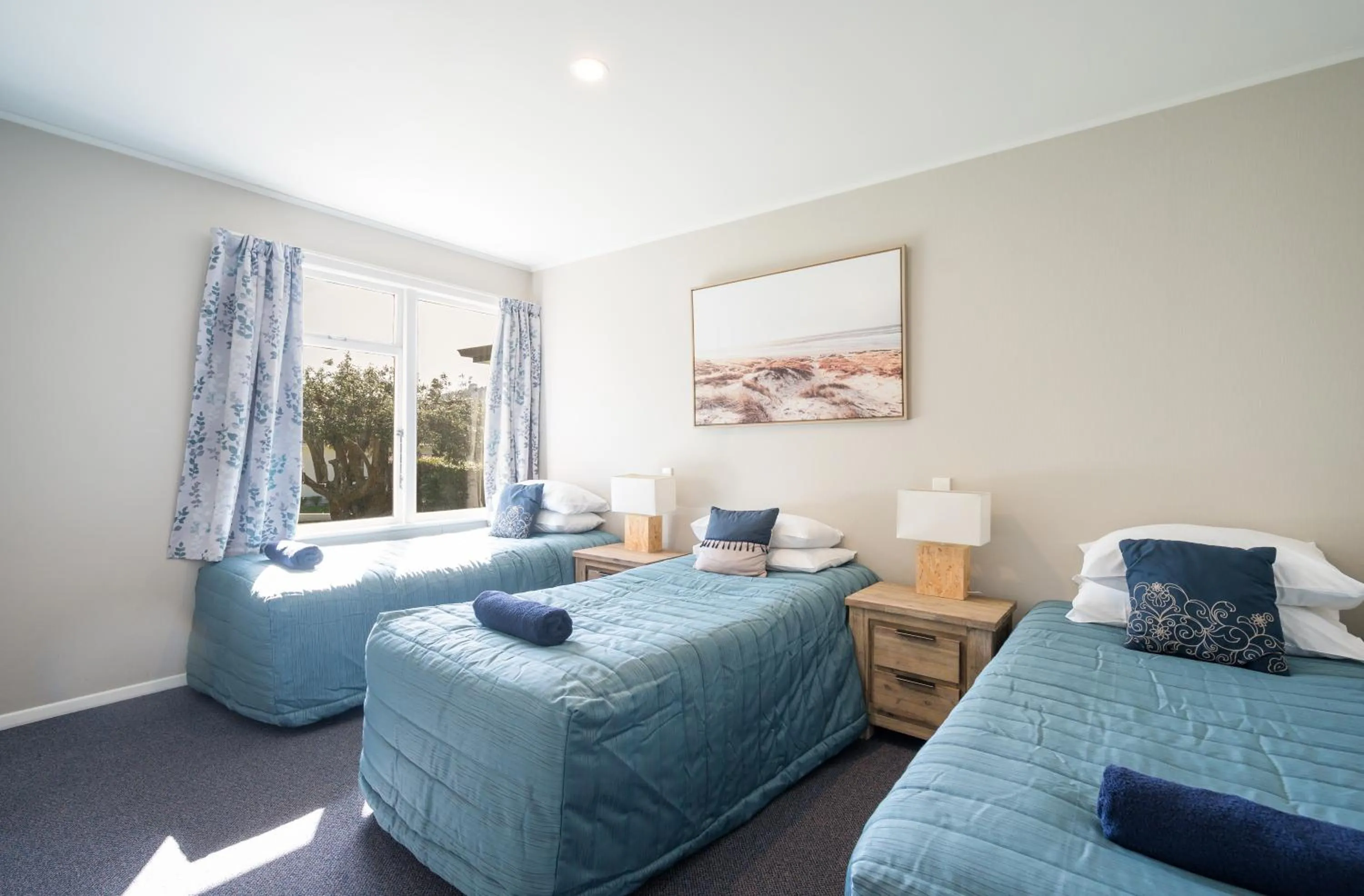 Bed in Tāhuna Beach Holiday Park