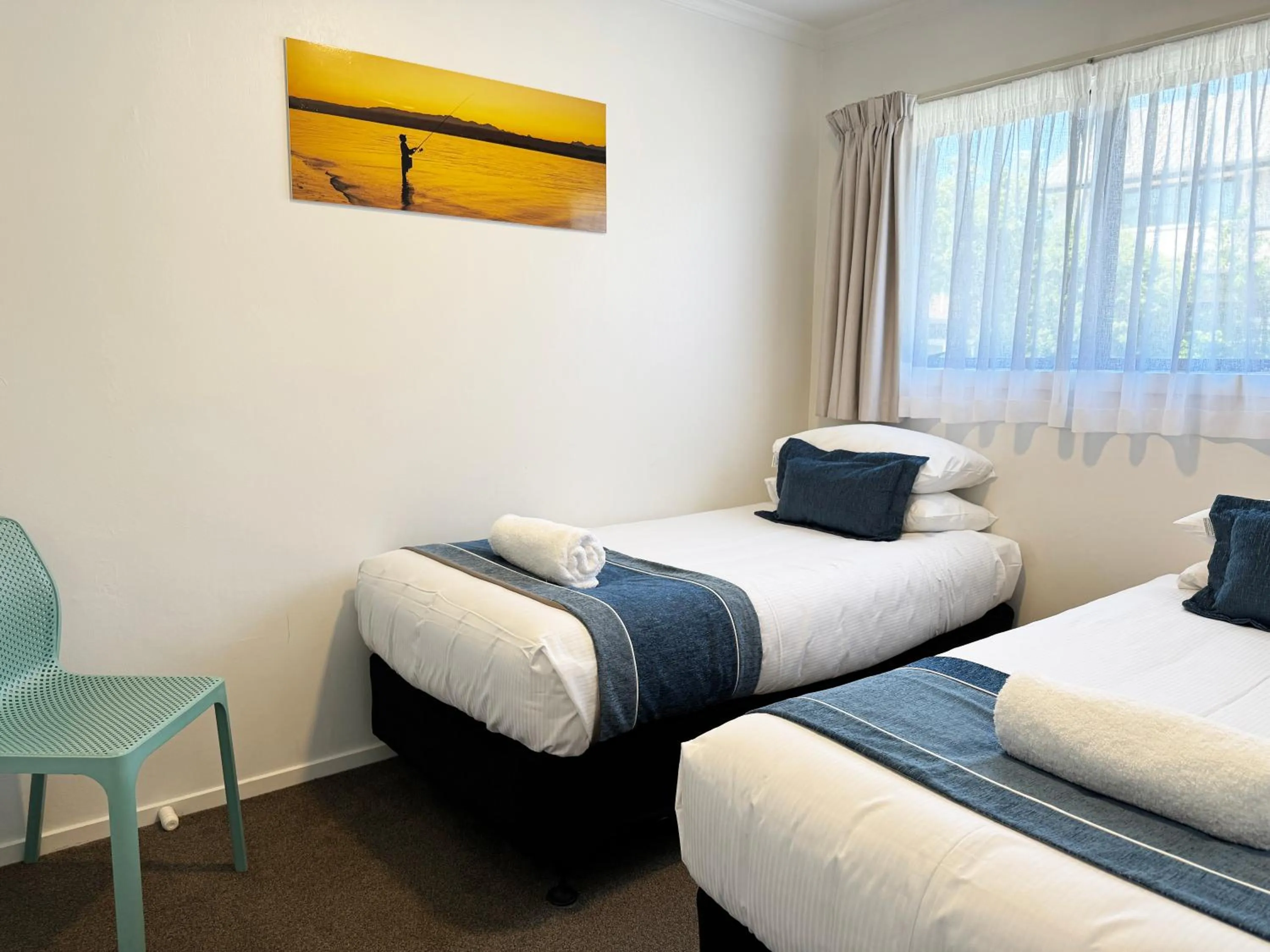 Bed in Tāhuna Beach Holiday Park