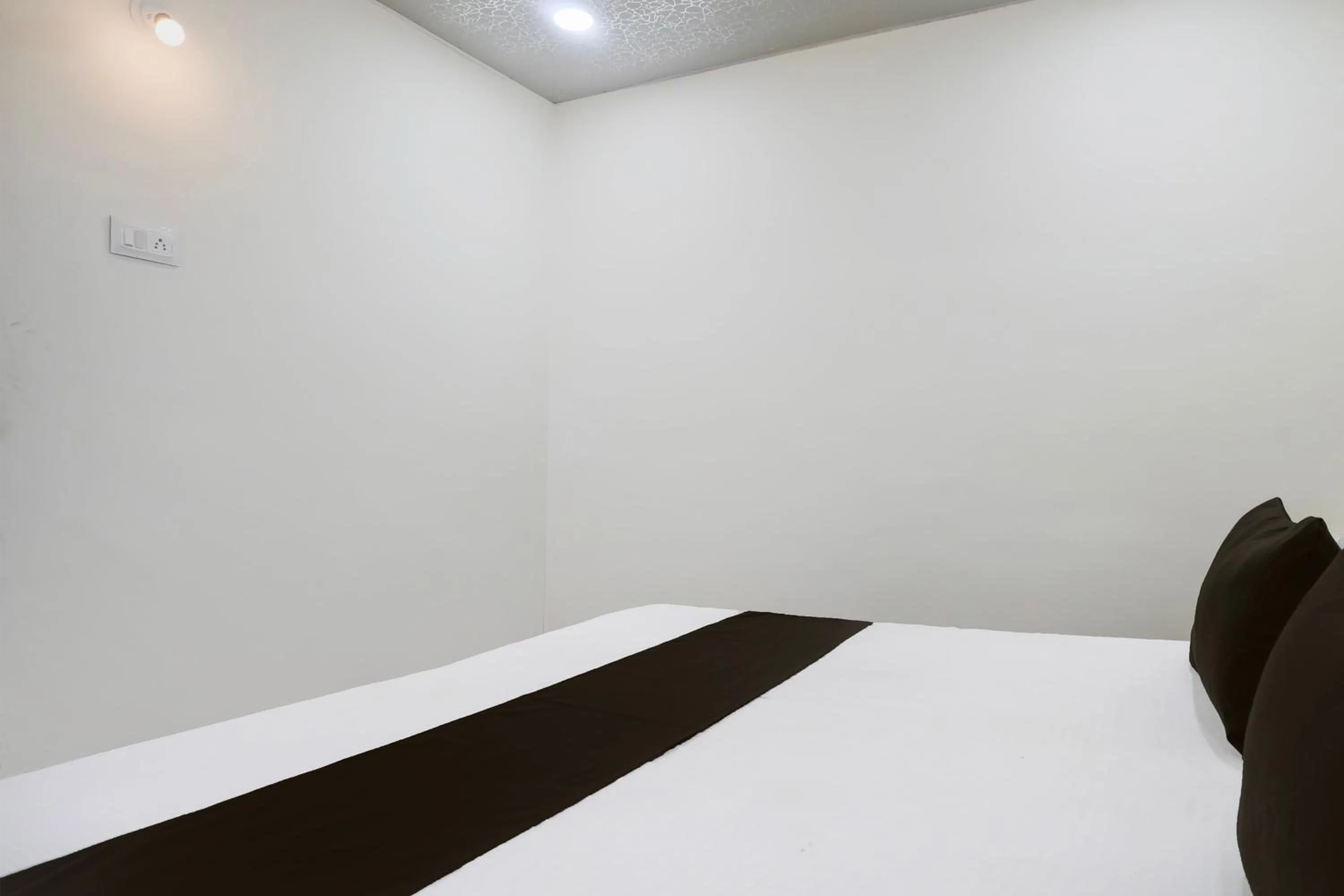 Bedroom in Hotel O Sky Villa