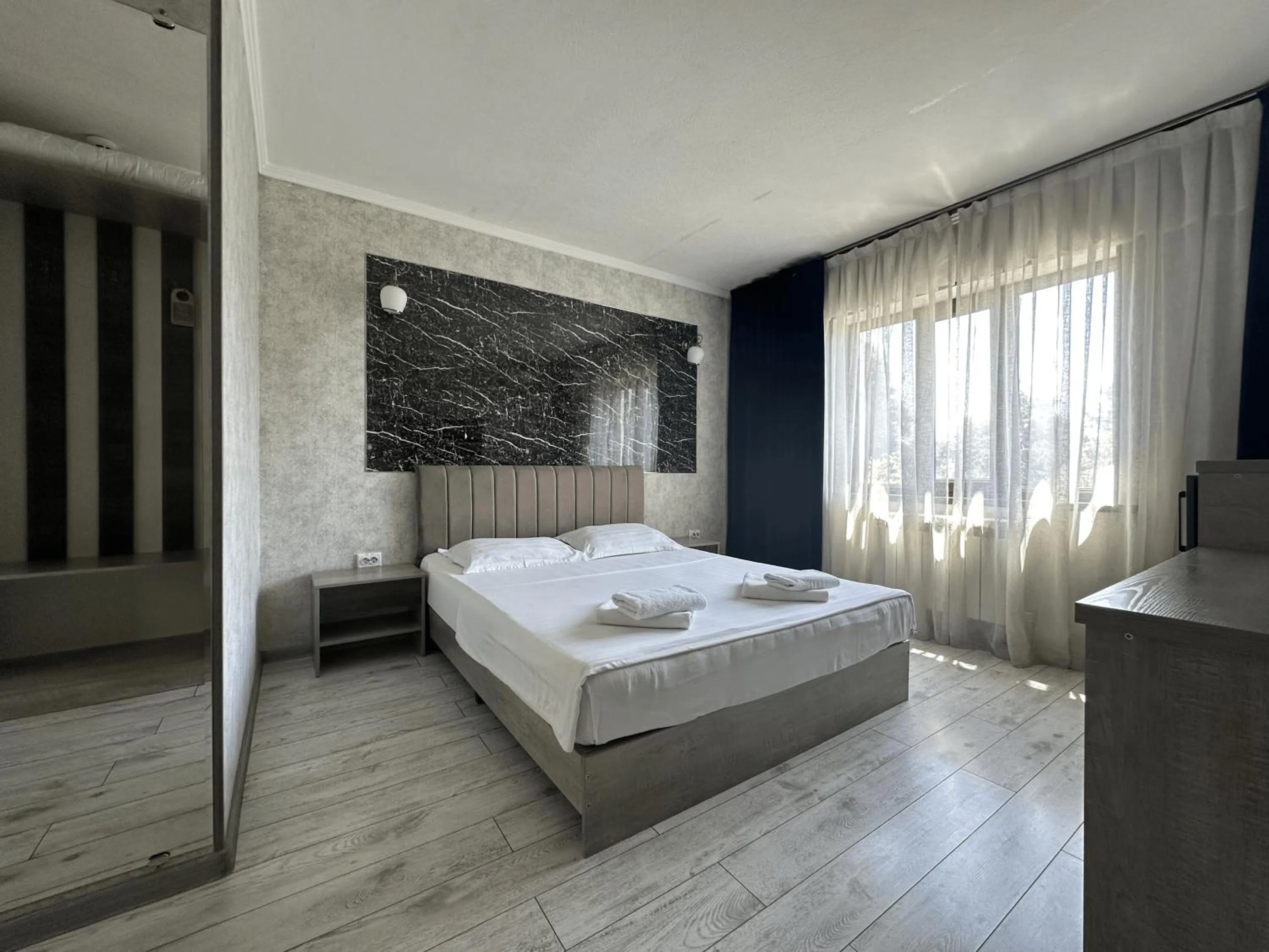 Bed in Artist Regency Hotel