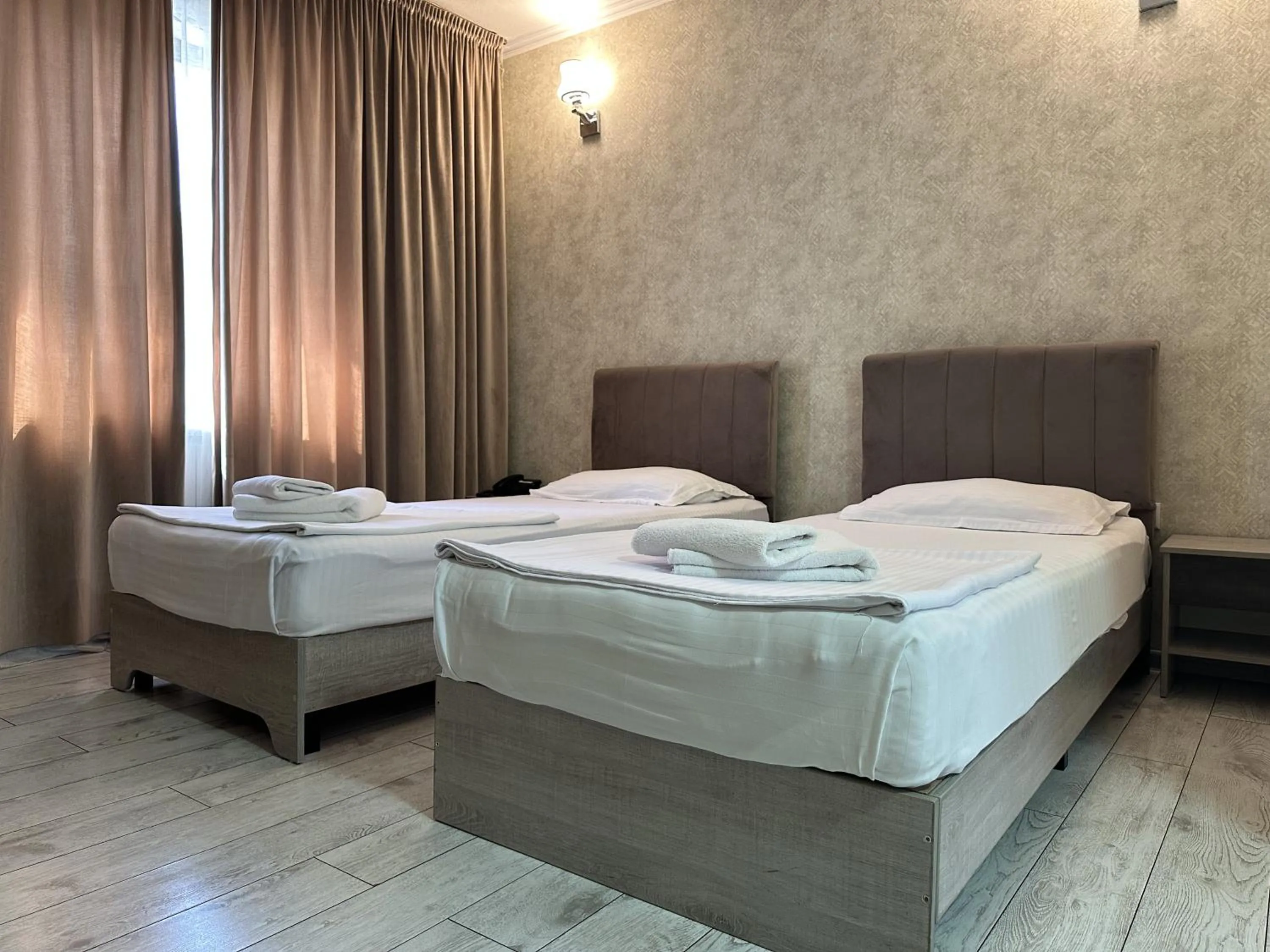 Bed in Artist Regency Hotel