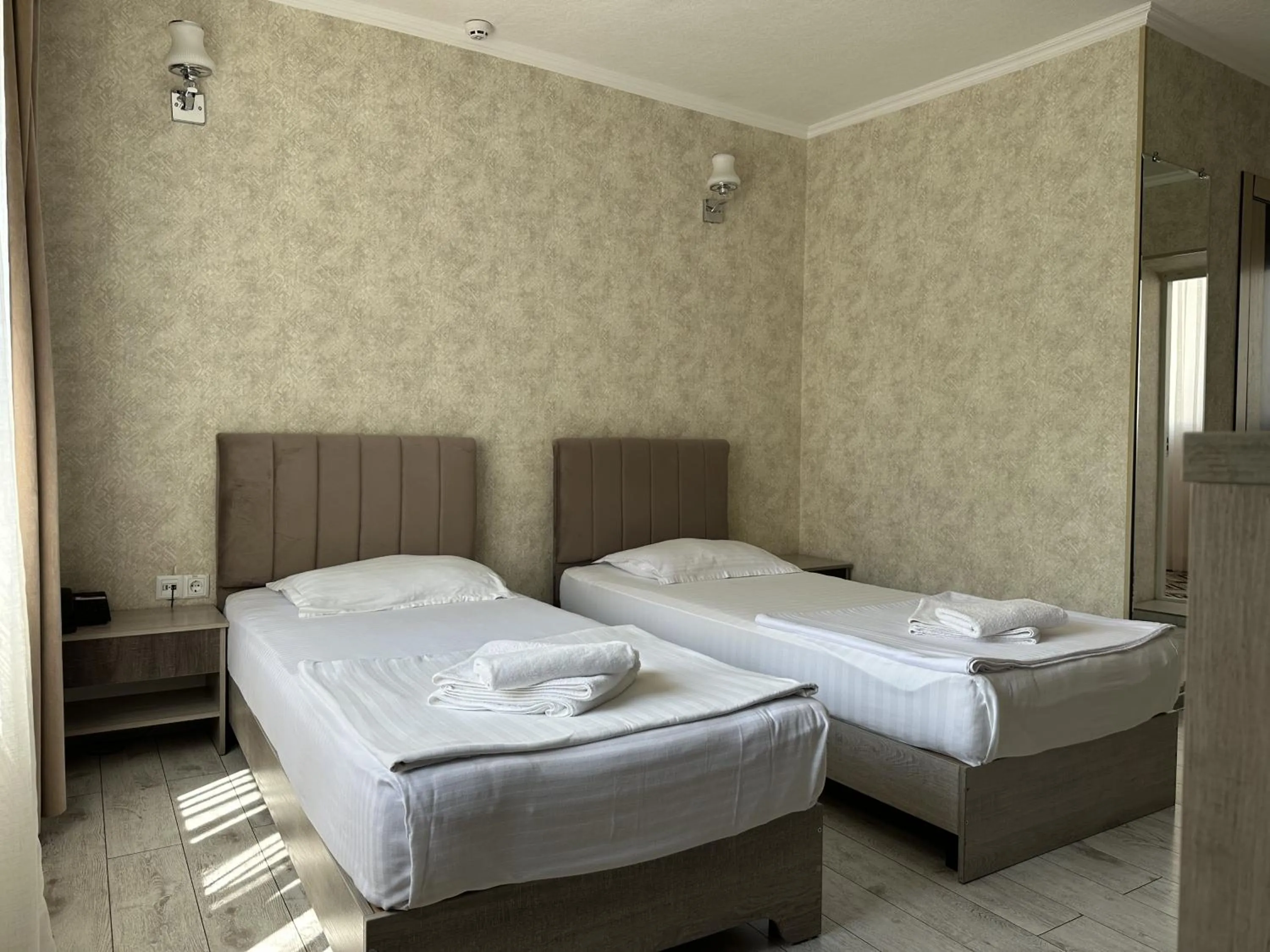 Bed in Artist Regency Hotel