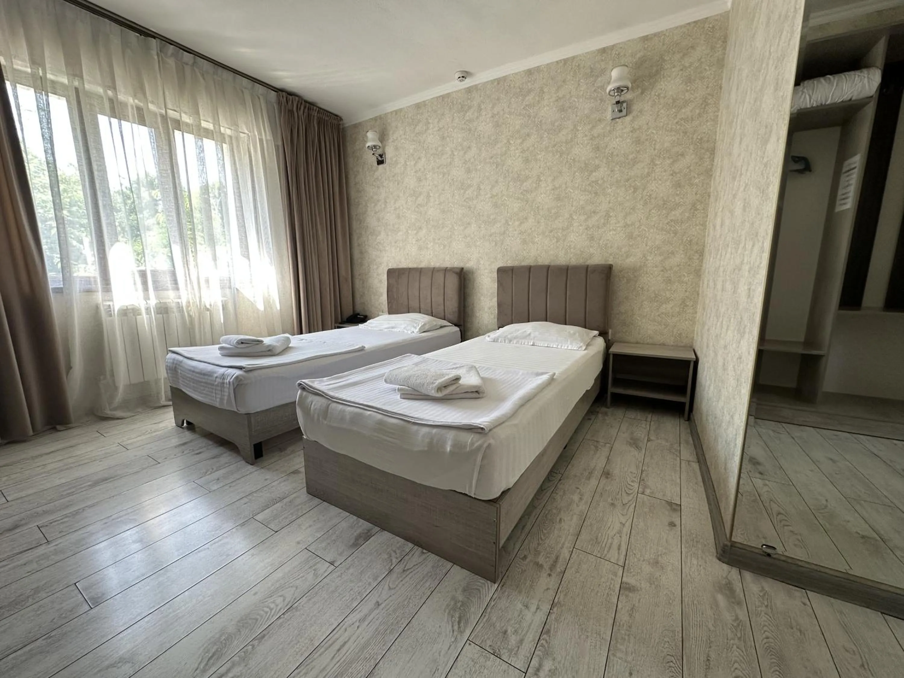 Bed in Artist Regency Hotel