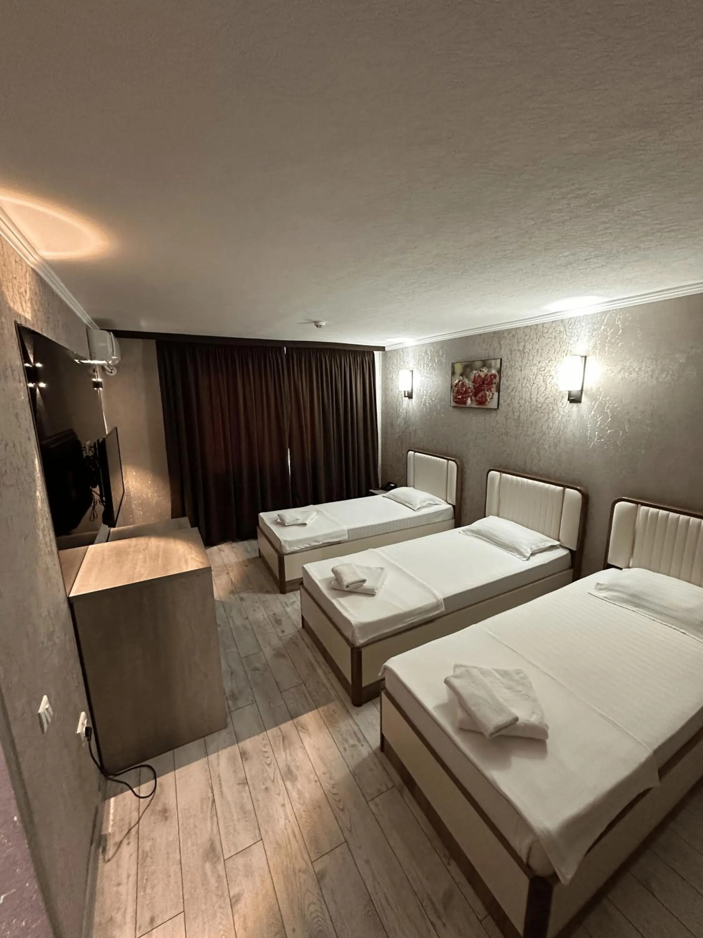 Bed in Artist Regency Hotel