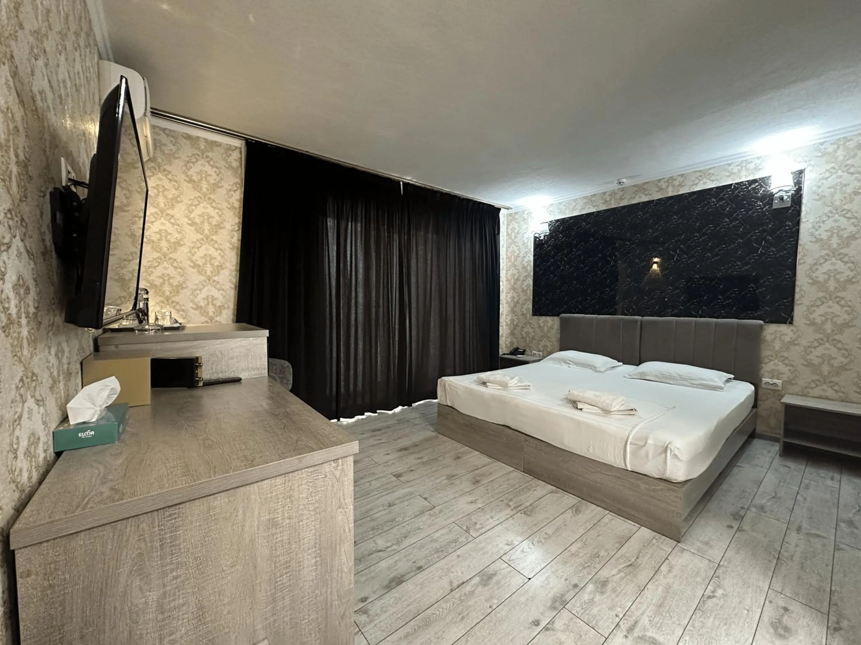 Bed in Artist Regency Hotel