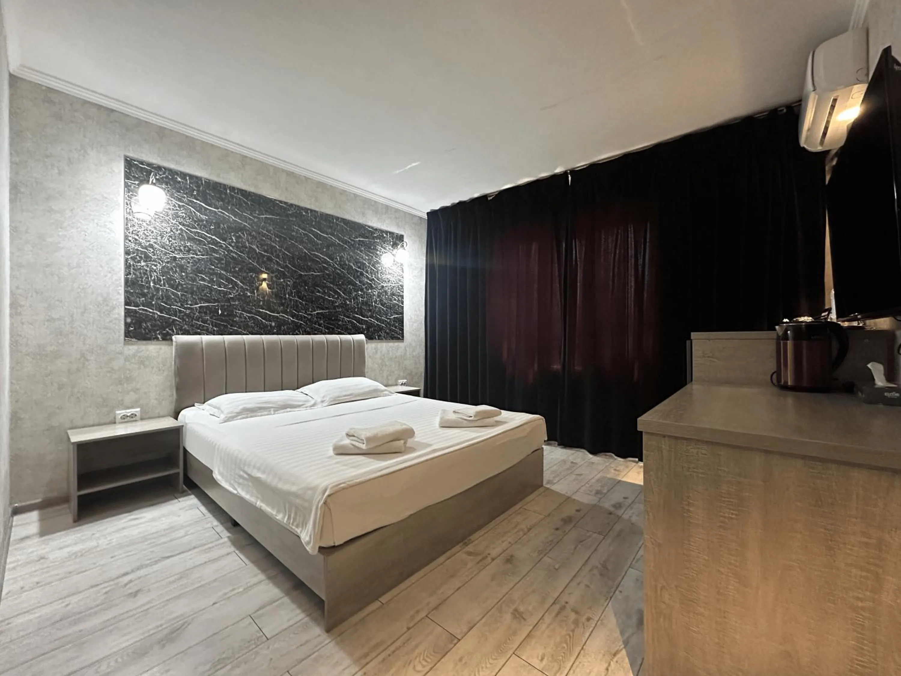 Bed in Artist Regency Hotel