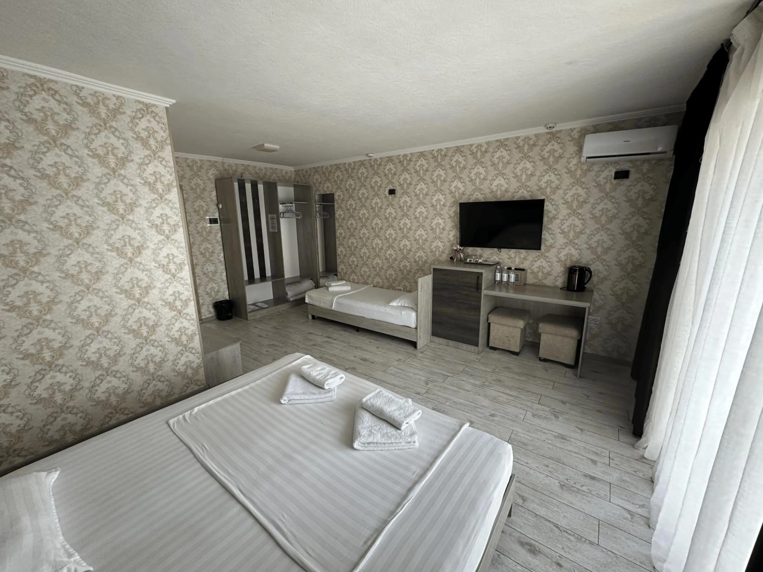 Bed in Artist Regency Hotel