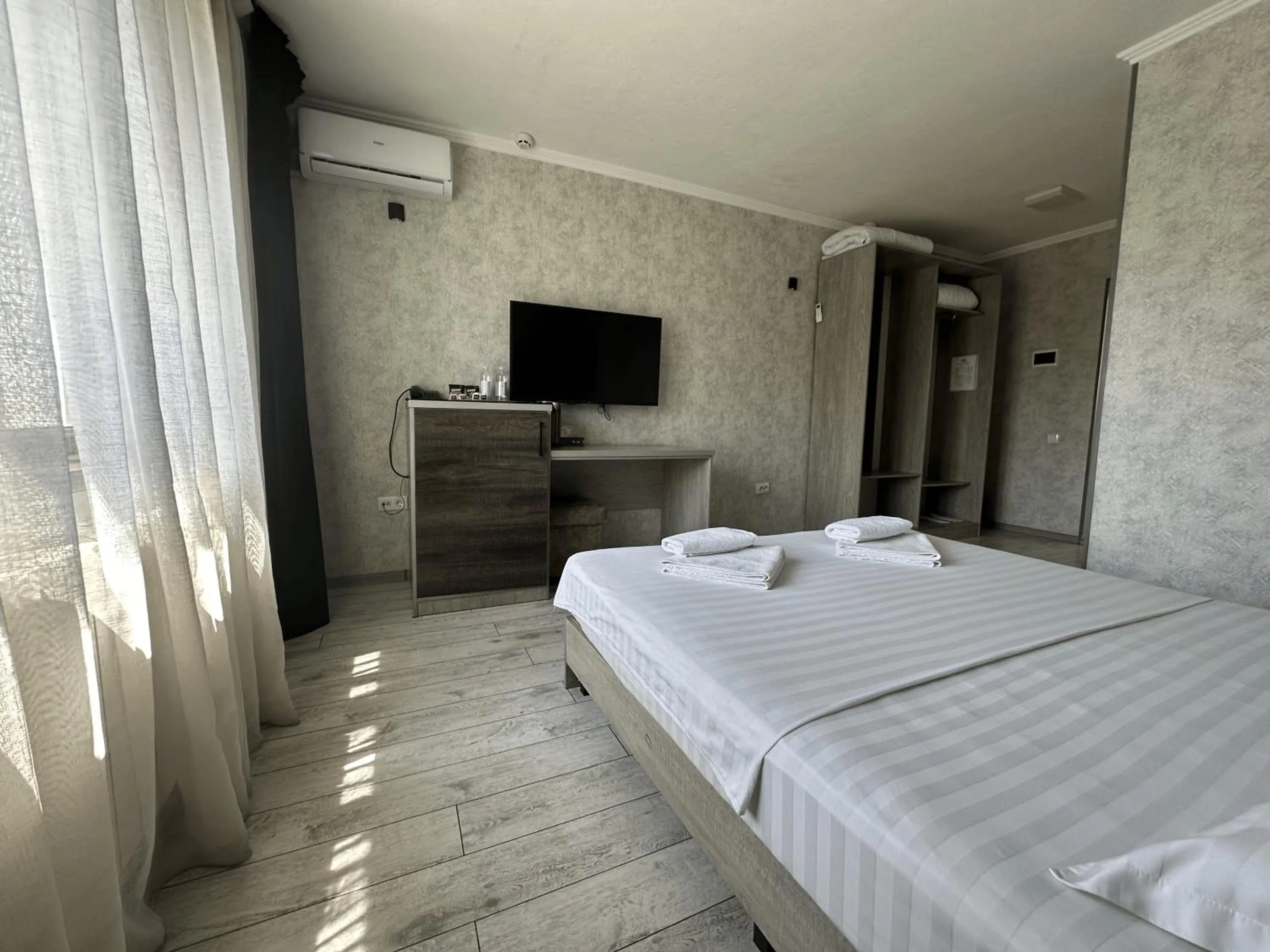 Bed in Artist Regency Hotel