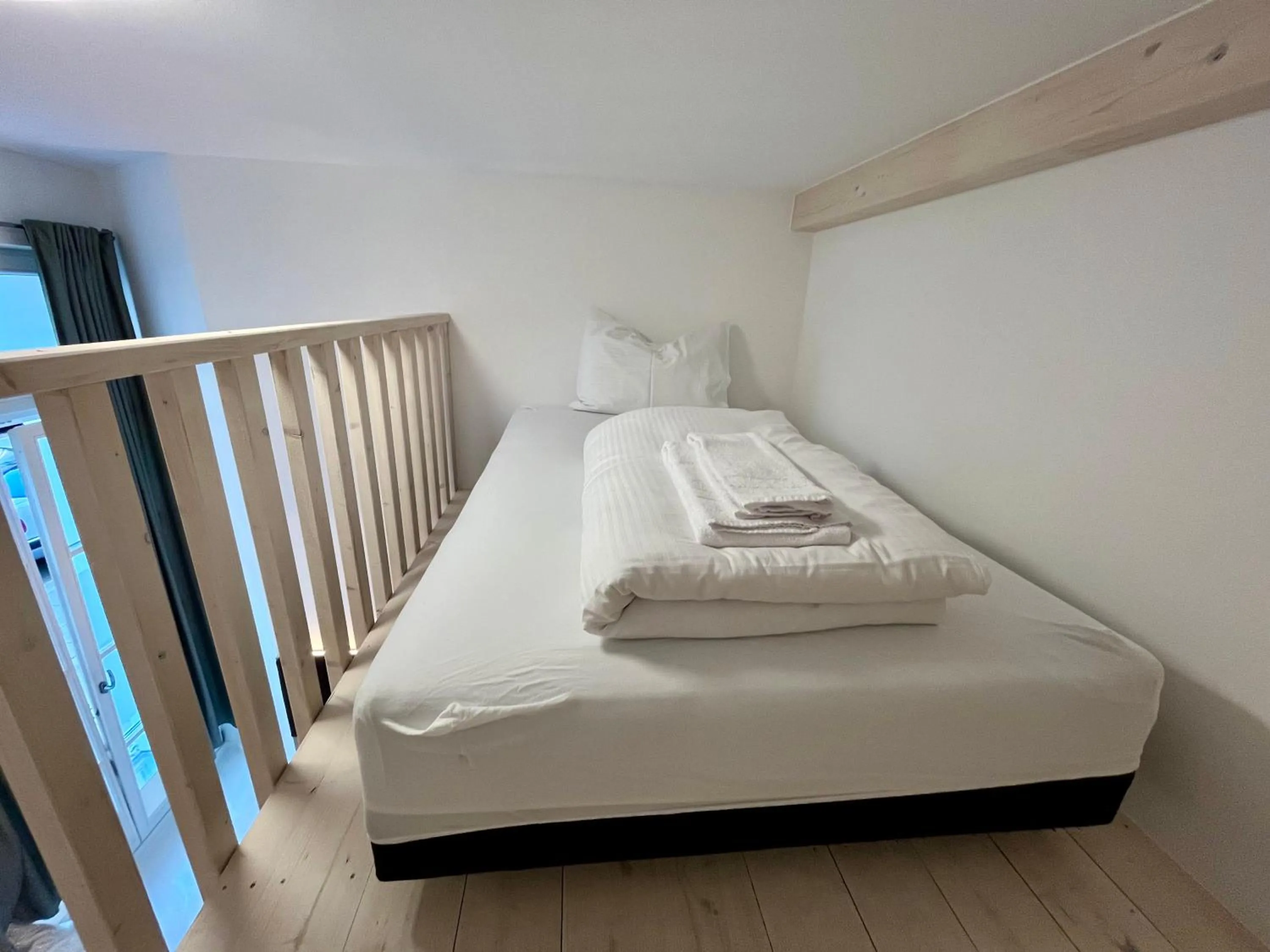 Bed in Adlzreiter City Pension