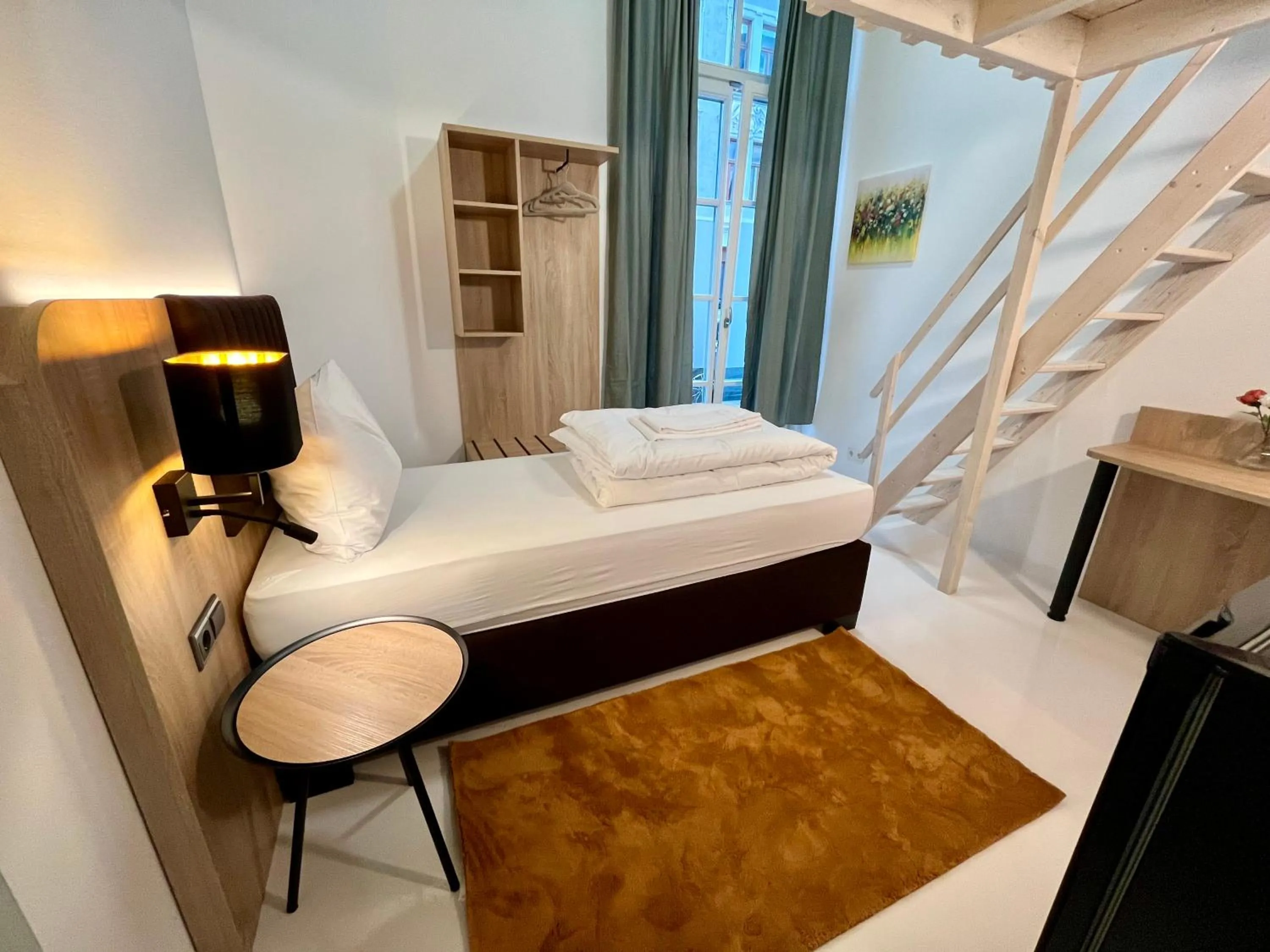 Bed in Adlzreiter City Pension