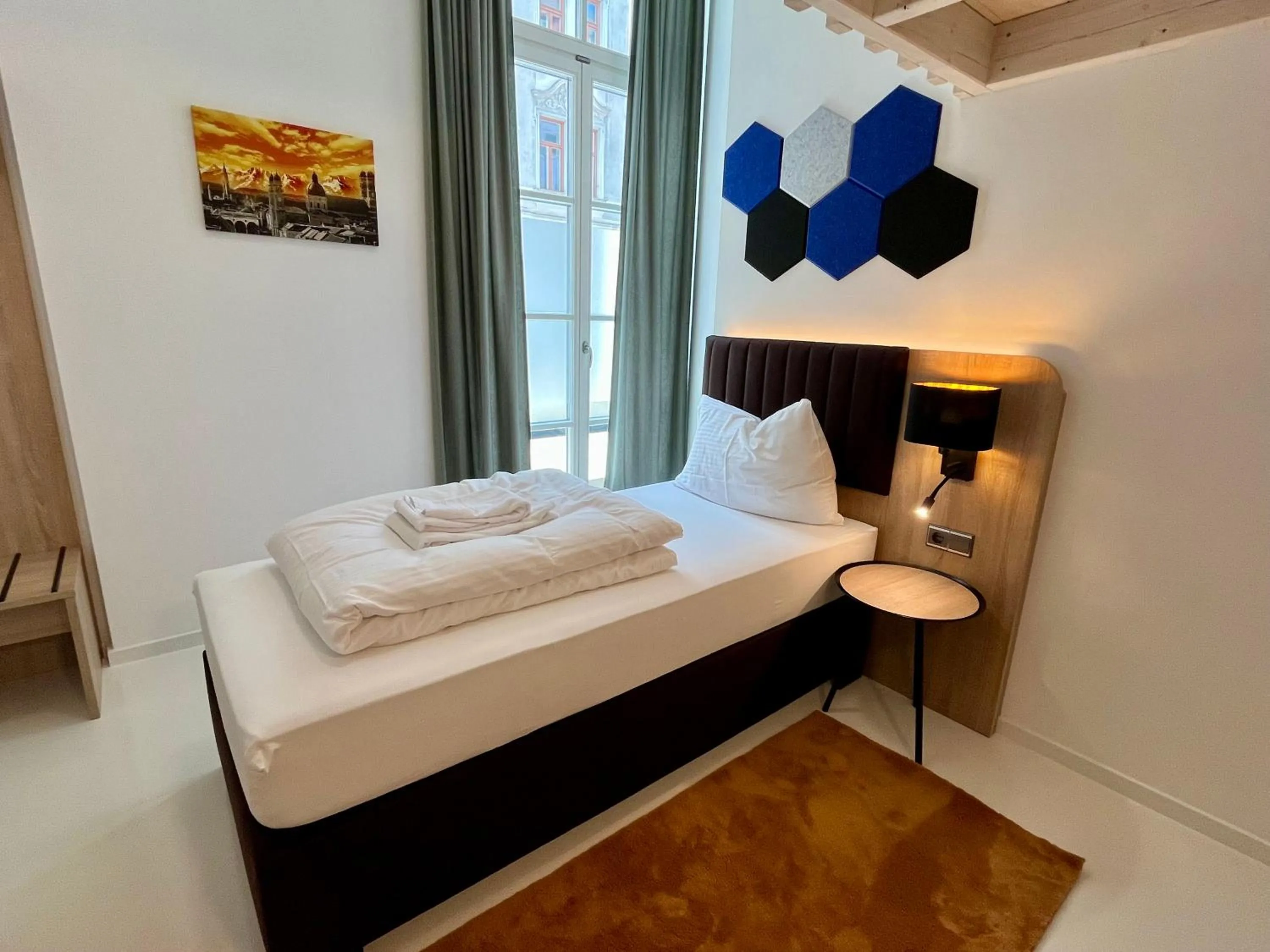 Bed in Adlzreiter City Pension