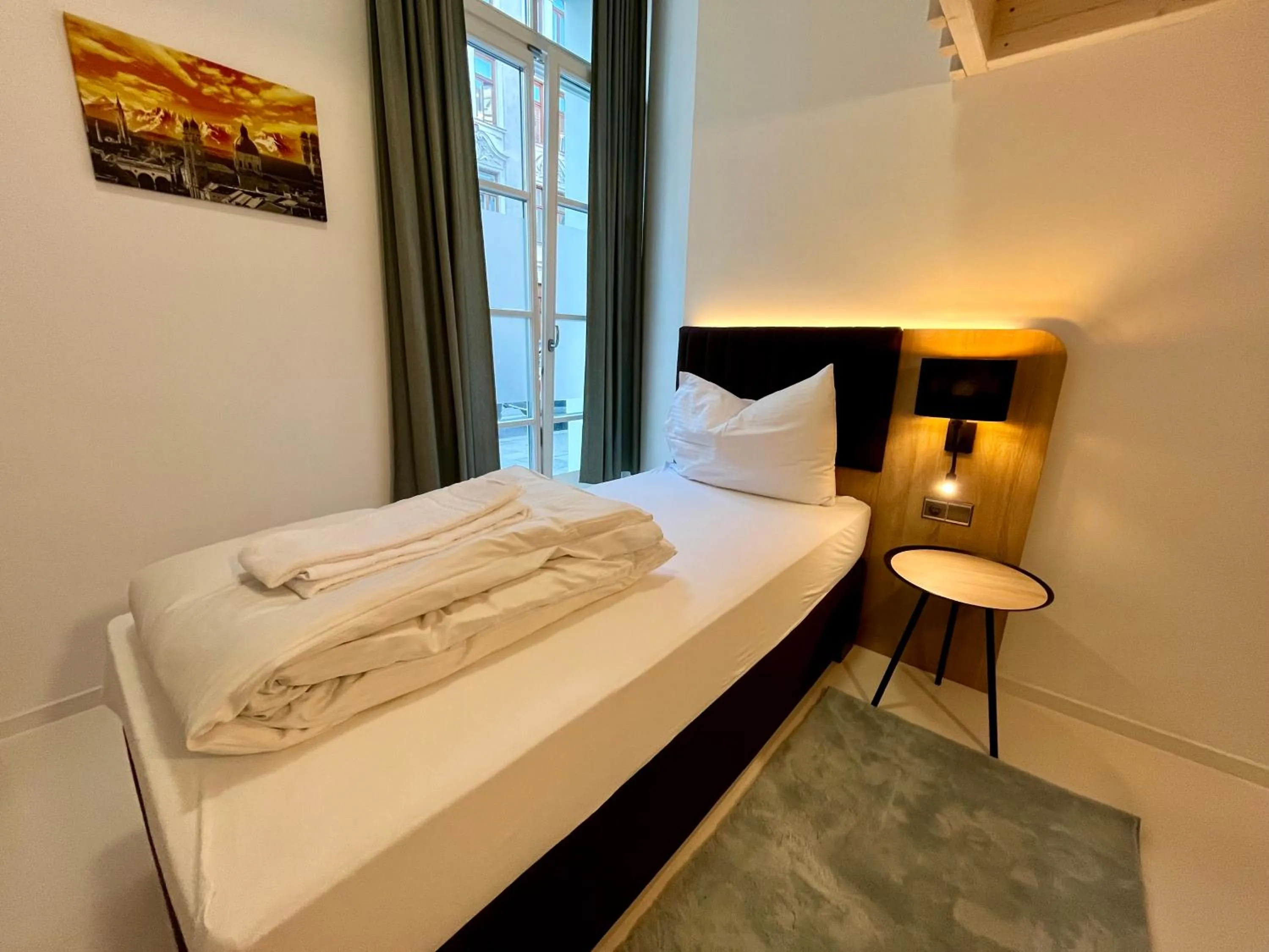 Bed in Adlzreiter City Pension