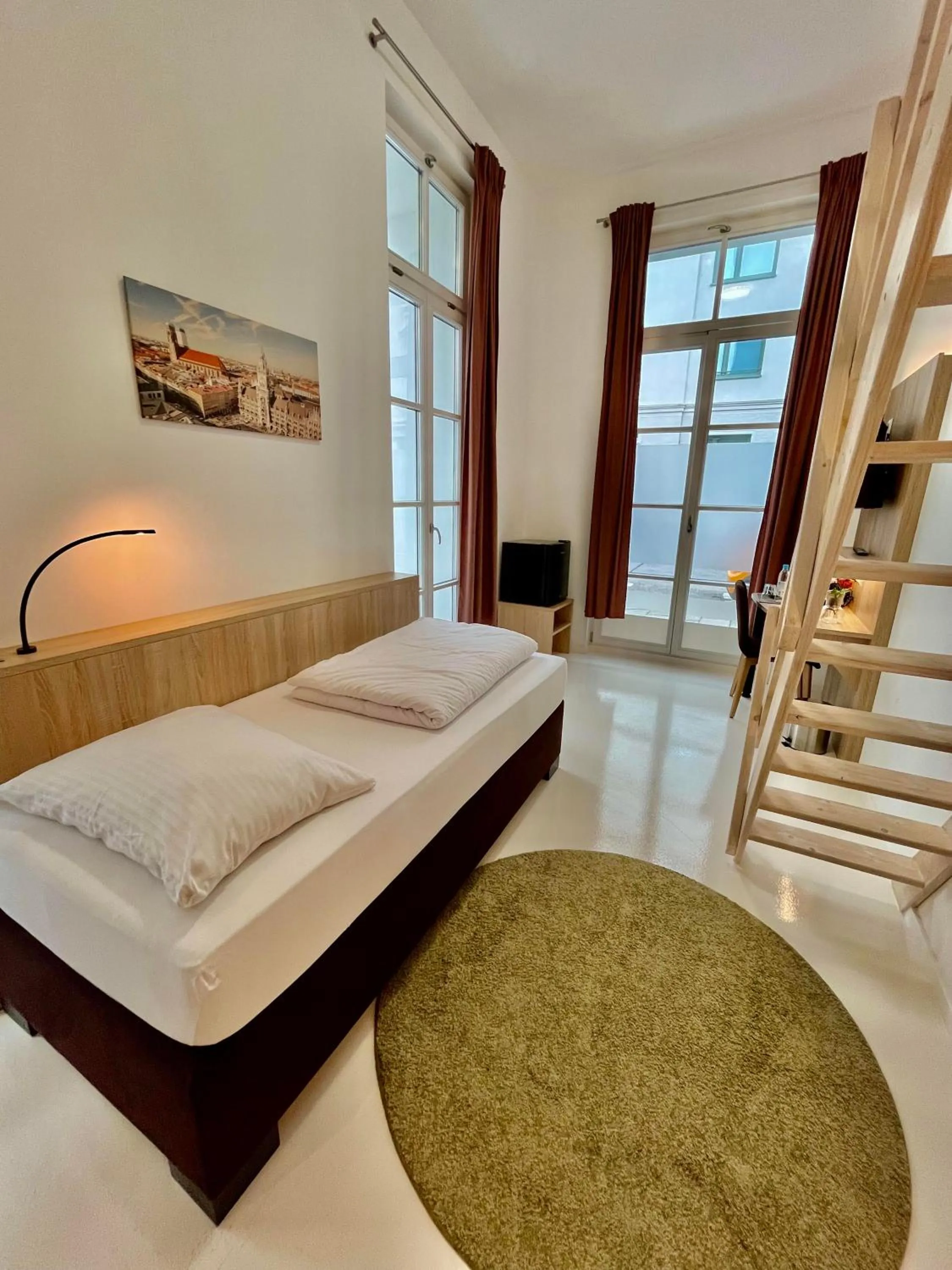 Bed in Adlzreiter City Pension