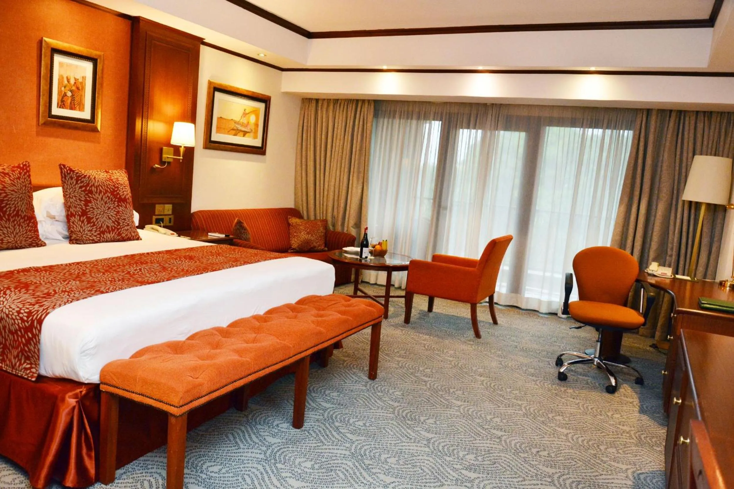 Seating area, Bed in Kampala Serena Hotel