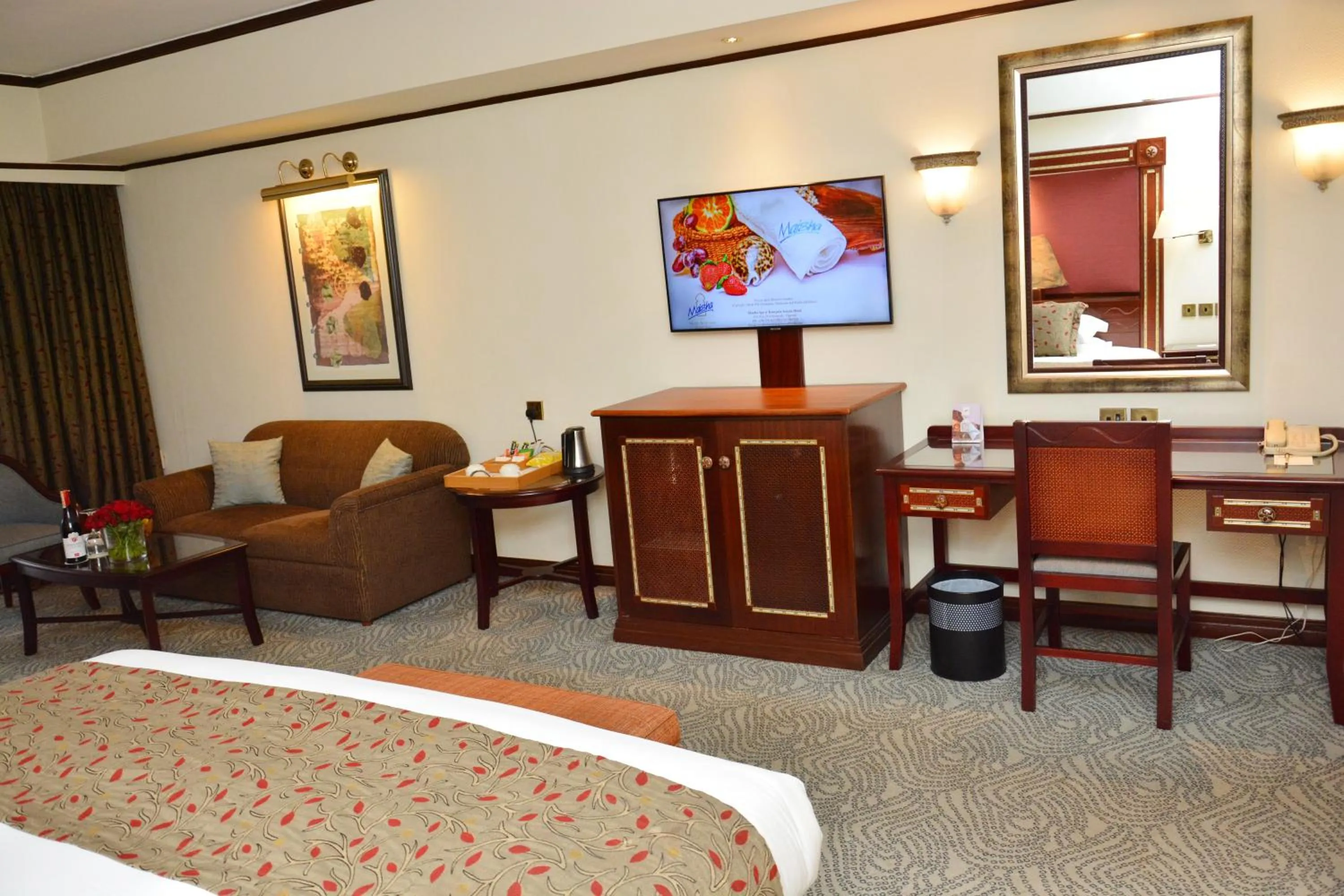 Seating area, Bed in Kampala Serena Hotel