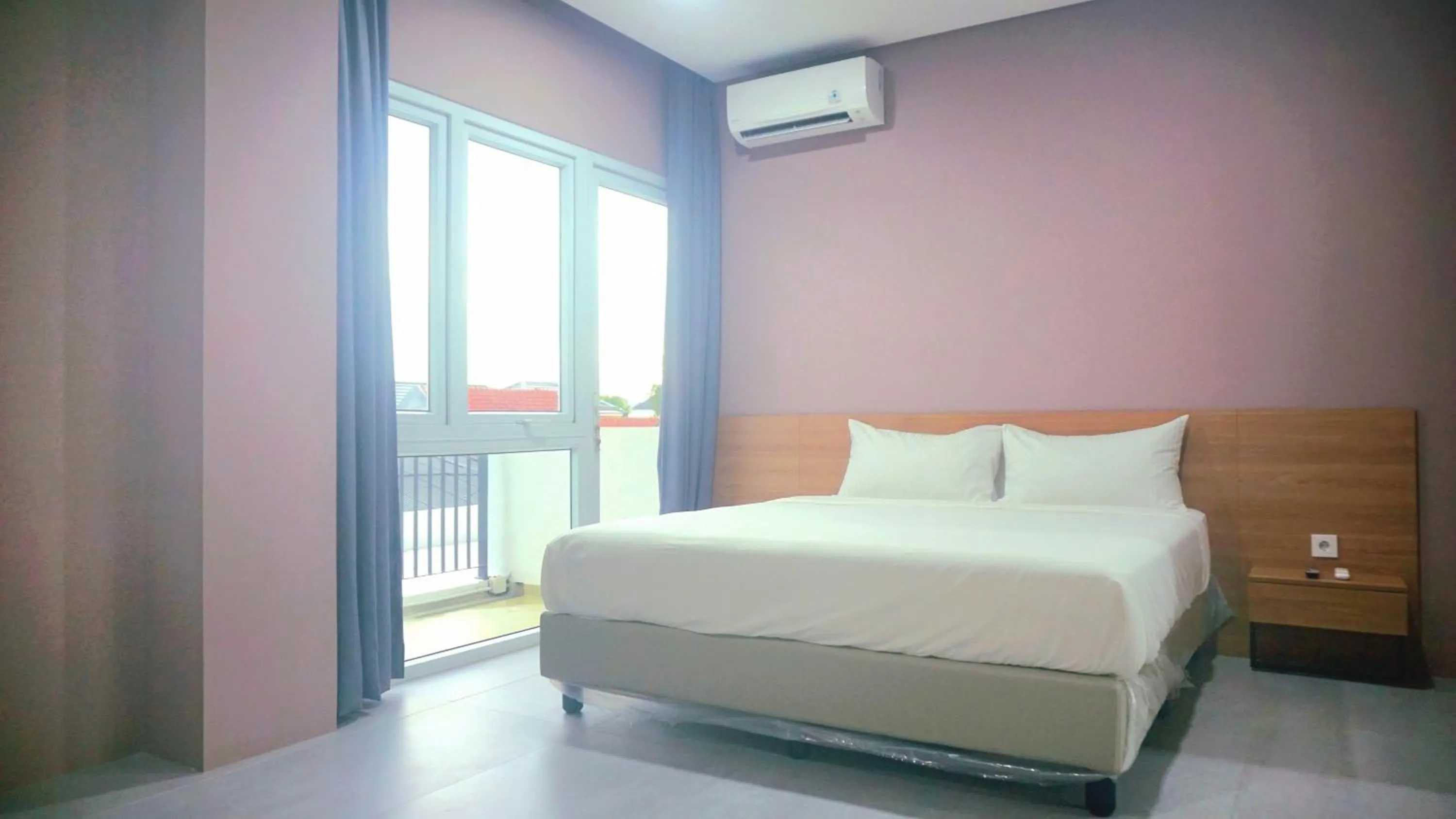 Bed in VNC Alam Sutera Hotel Powered by Archipelago