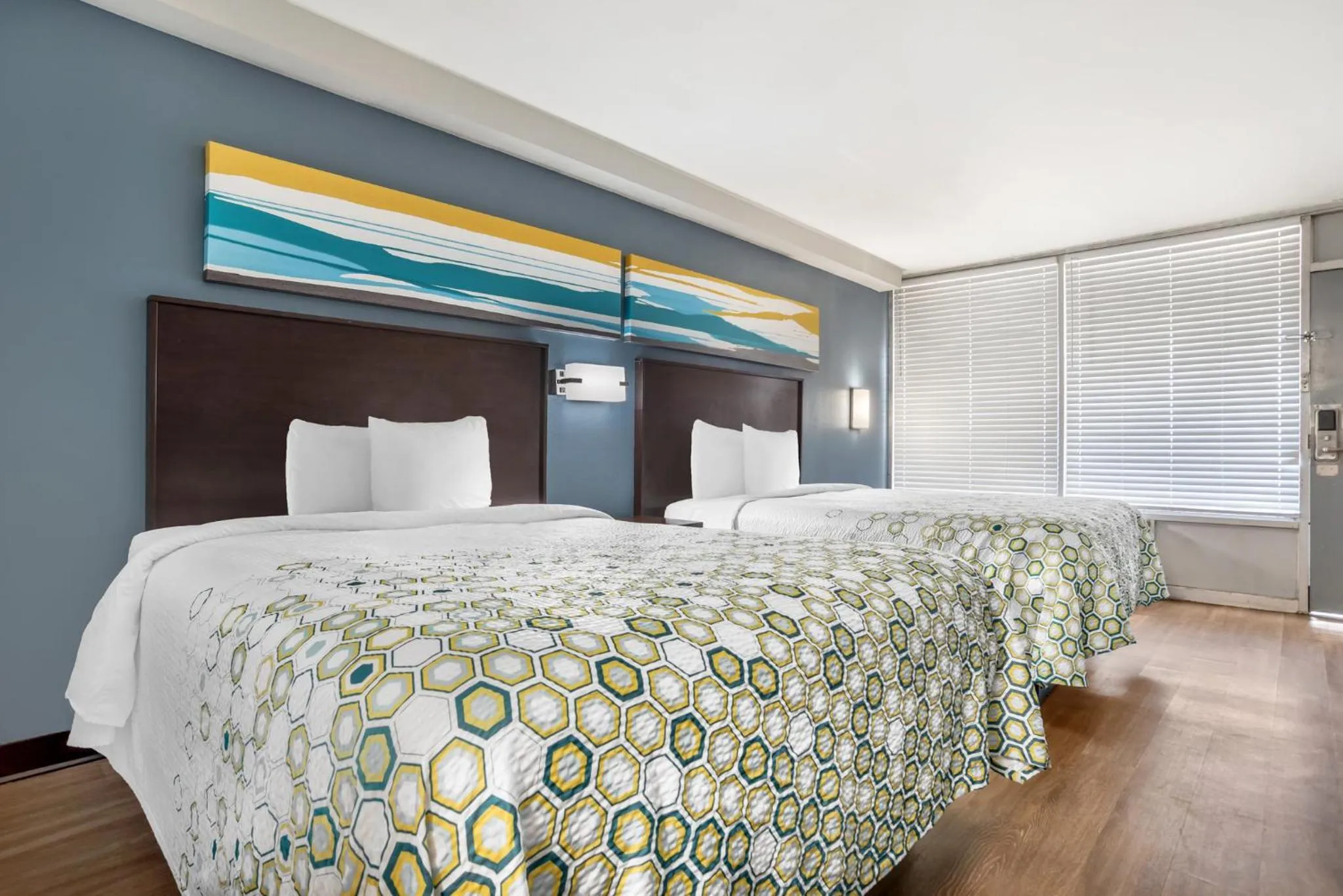 Bedroom, Bed in HomeTowne Studios by Red Roof Montgomery - Midtown